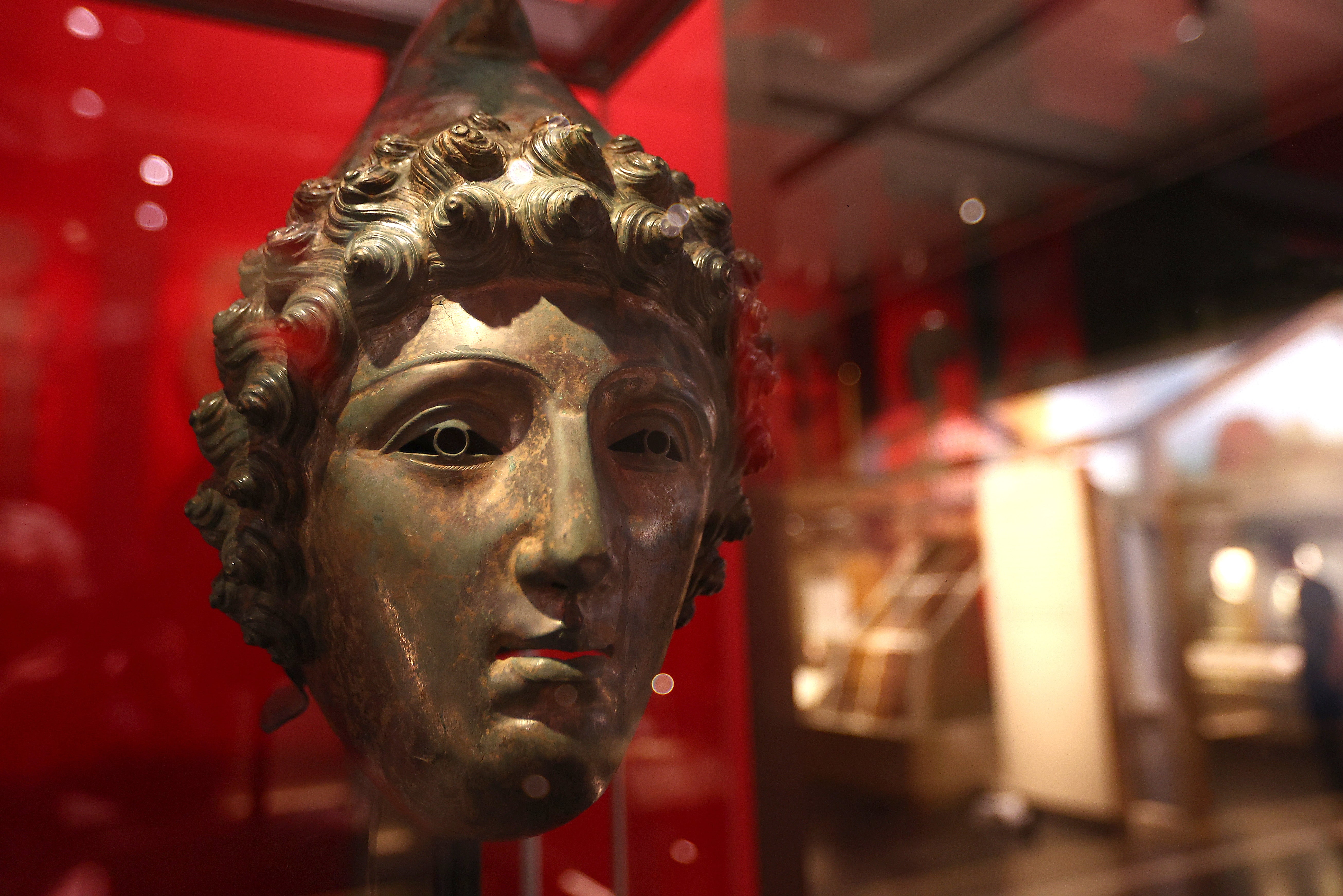 A helmet depicting the face of a Trojan on display at the ‘Legion: Life in the Roman Army exhibition