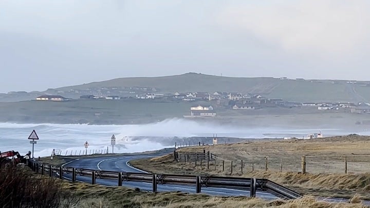 Waves crash over runway at Shetland’s Sumburgh airport as storm batters UK with 85mph winds.