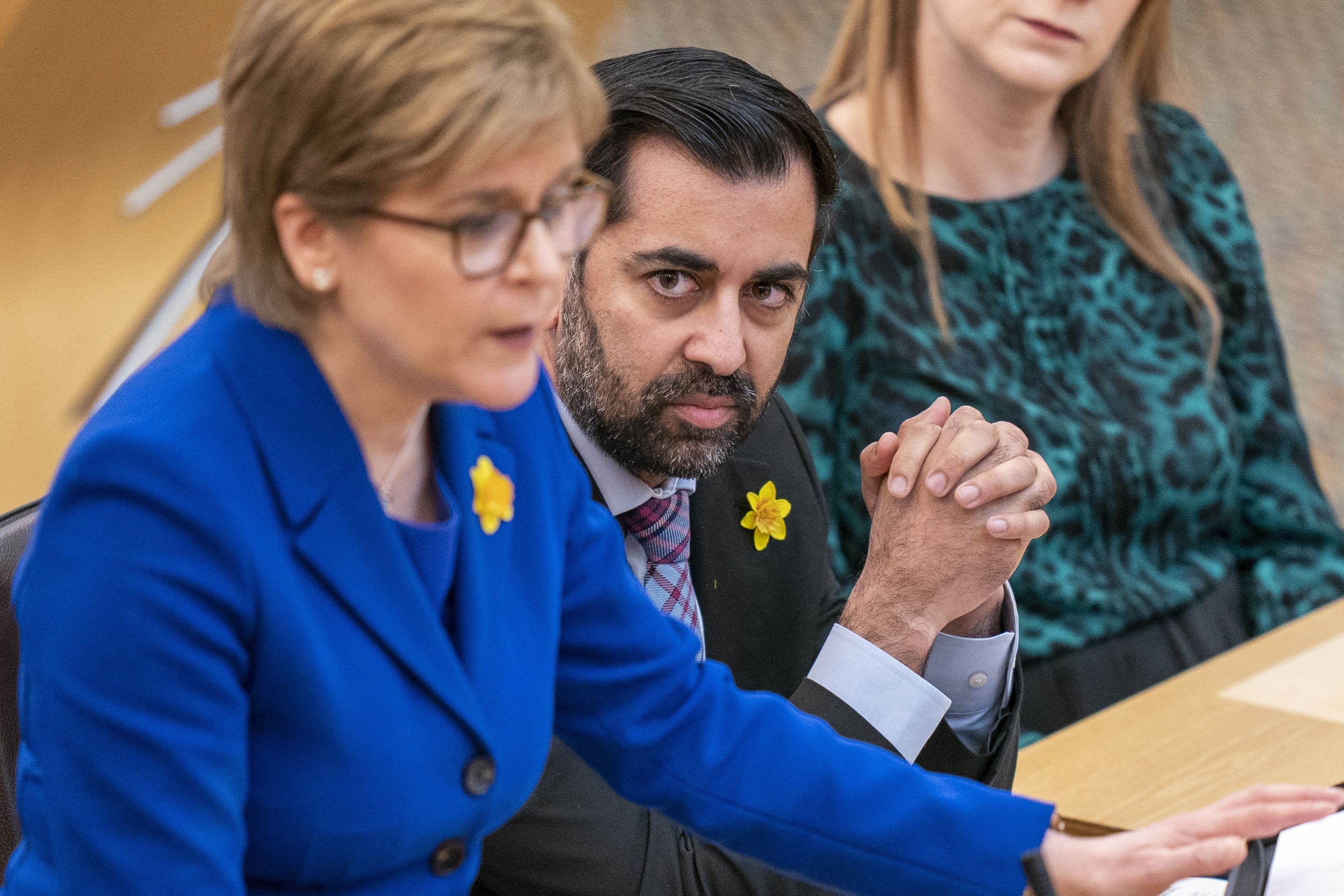 Humza Yousaf said he is glad Nicola Sturgeon was in charge during Covid (PA)