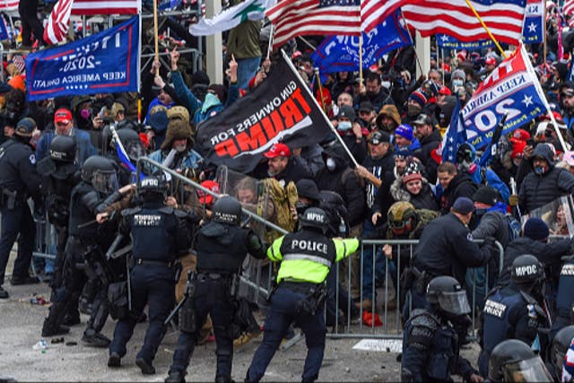 <p>Trump supporters clash with police and security forces as they storm the US Capitol in Washington, DC on January 6, 2021</p>