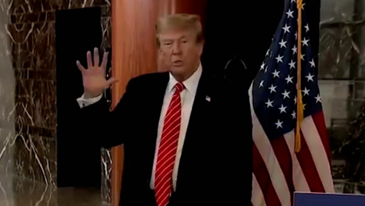 Trump makes AI joke when quizzed about red dots on his hands