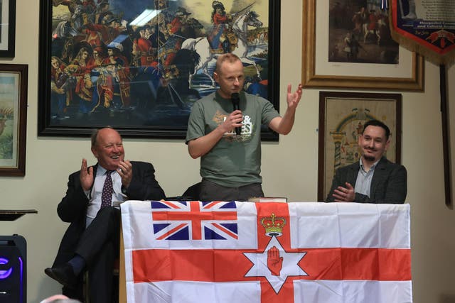 Jamie Bryson addresses the public meeting (Liam McBurney/PA)