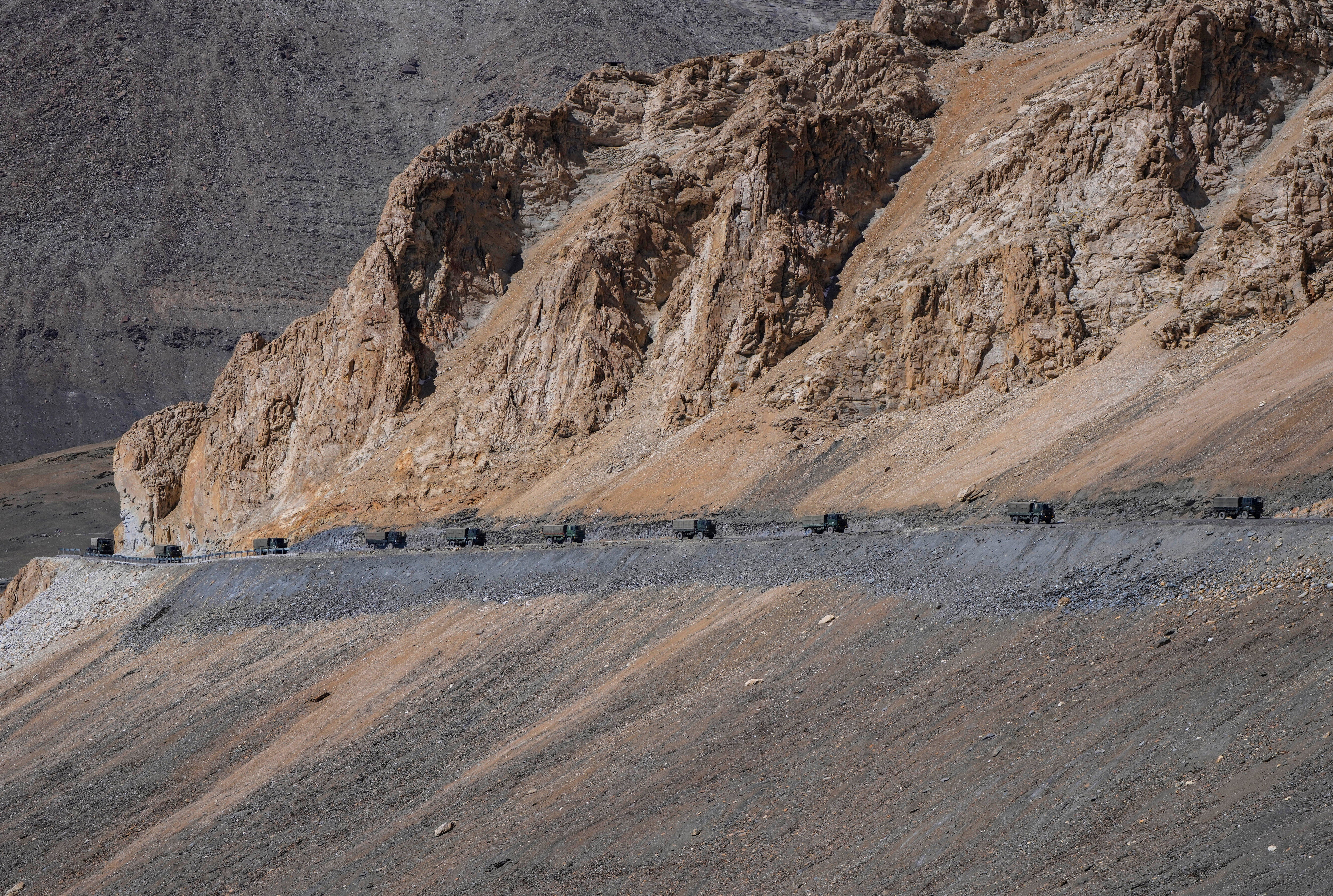 Indian army vehicles move in a convoy in the cold desert region of Ladakh, where India and China are locked in a military standoff,