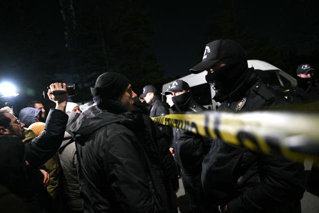<p>Relatives of hostages gather as Turkish anti-riot police officers block the street where a plant owned by Procter & Gamble is located</p>