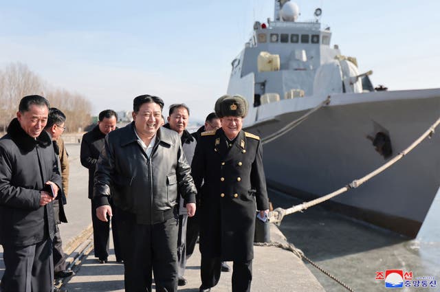 <p>This undated photo released by North Korea’s official Korean Central News Agency (KCNA) on February 2, 2024 shows North Korean leader Kim Jong Un (C) inspecting the Nampho Dockyard in North Korea</p>