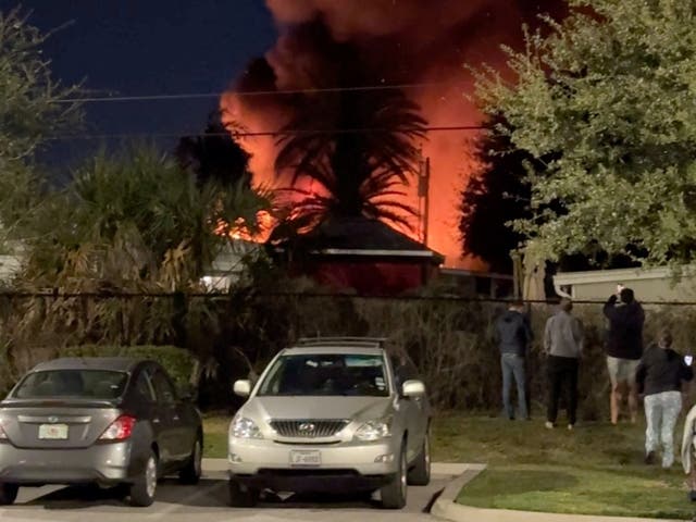 <p>A plume of smoke rises after a small plane crashes in a trailer park in Clearwater, Florida</p>