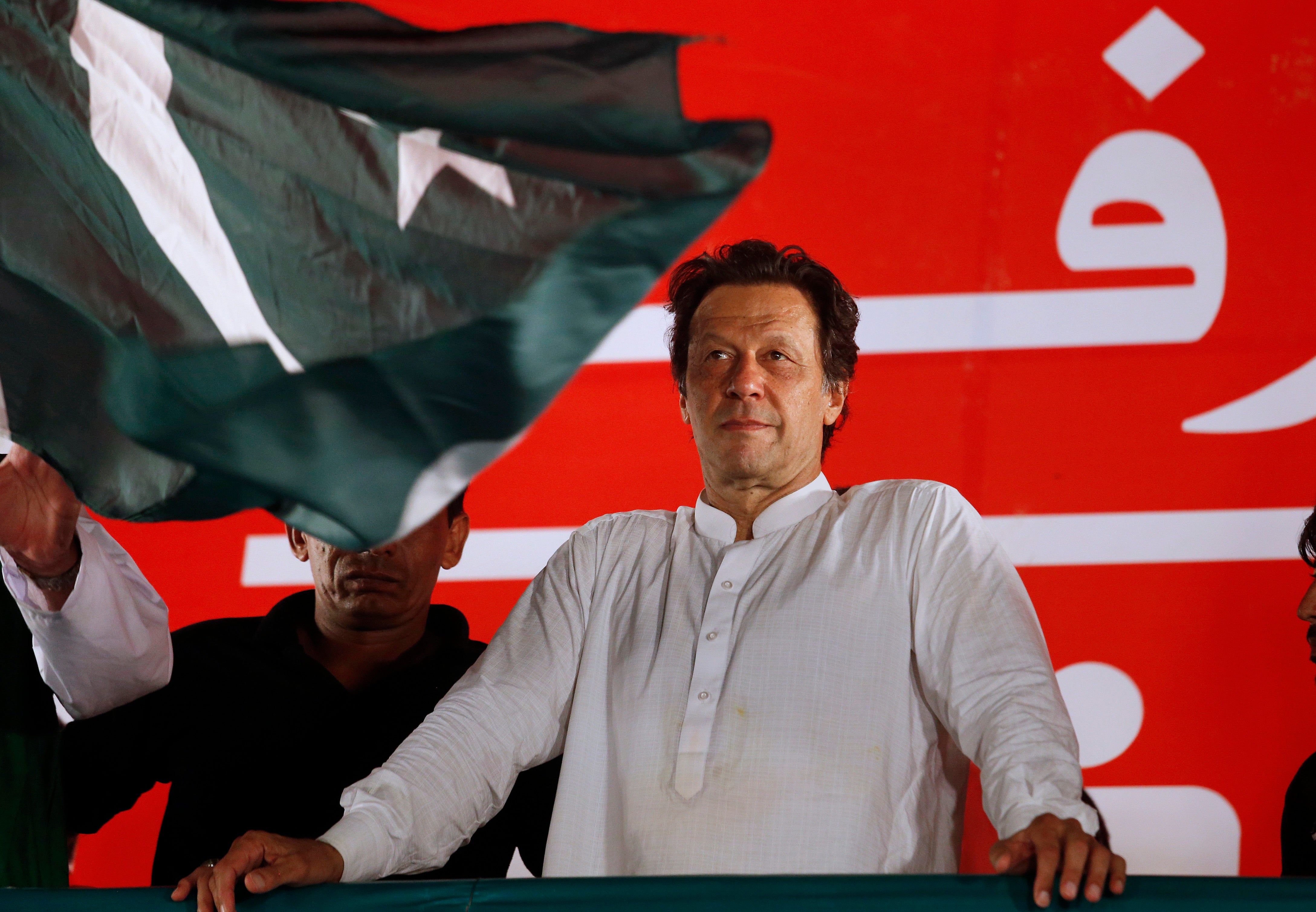 Pakistani politician Imran Khan, chief of Pakistan Tehreek-e-Insaf party, arrives to address an election campaign rally in Islamabad in 2018 – today he’s facing a lifetime behind bars