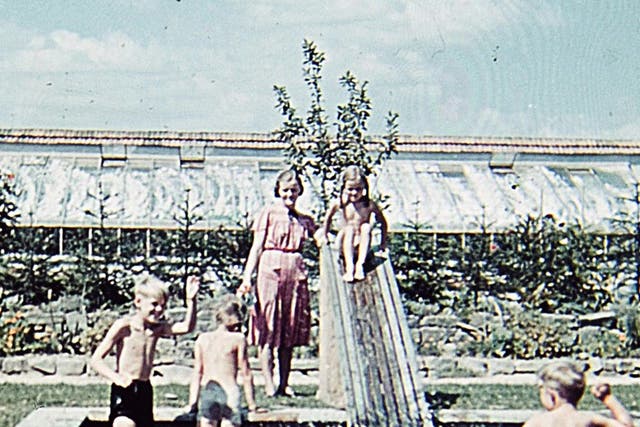 <p>H?ss’s children play in the pool at their villa </p>