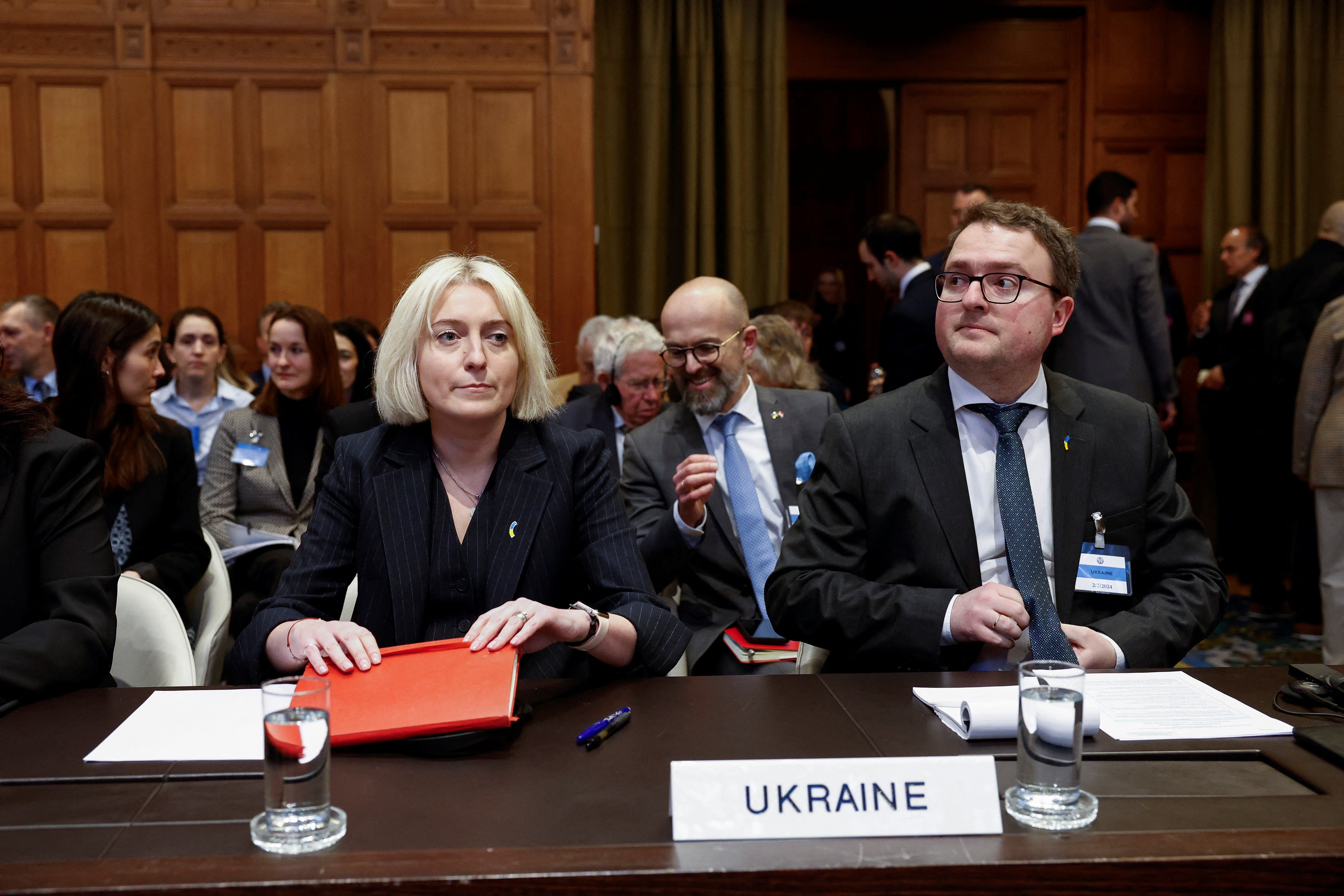 Ukrainian Foreign Ministry’s Director General for International Law Oksana Zolotaryova and Ambassador-at-large Anton Korynevych sit as the International Court of Justice (ICJ)