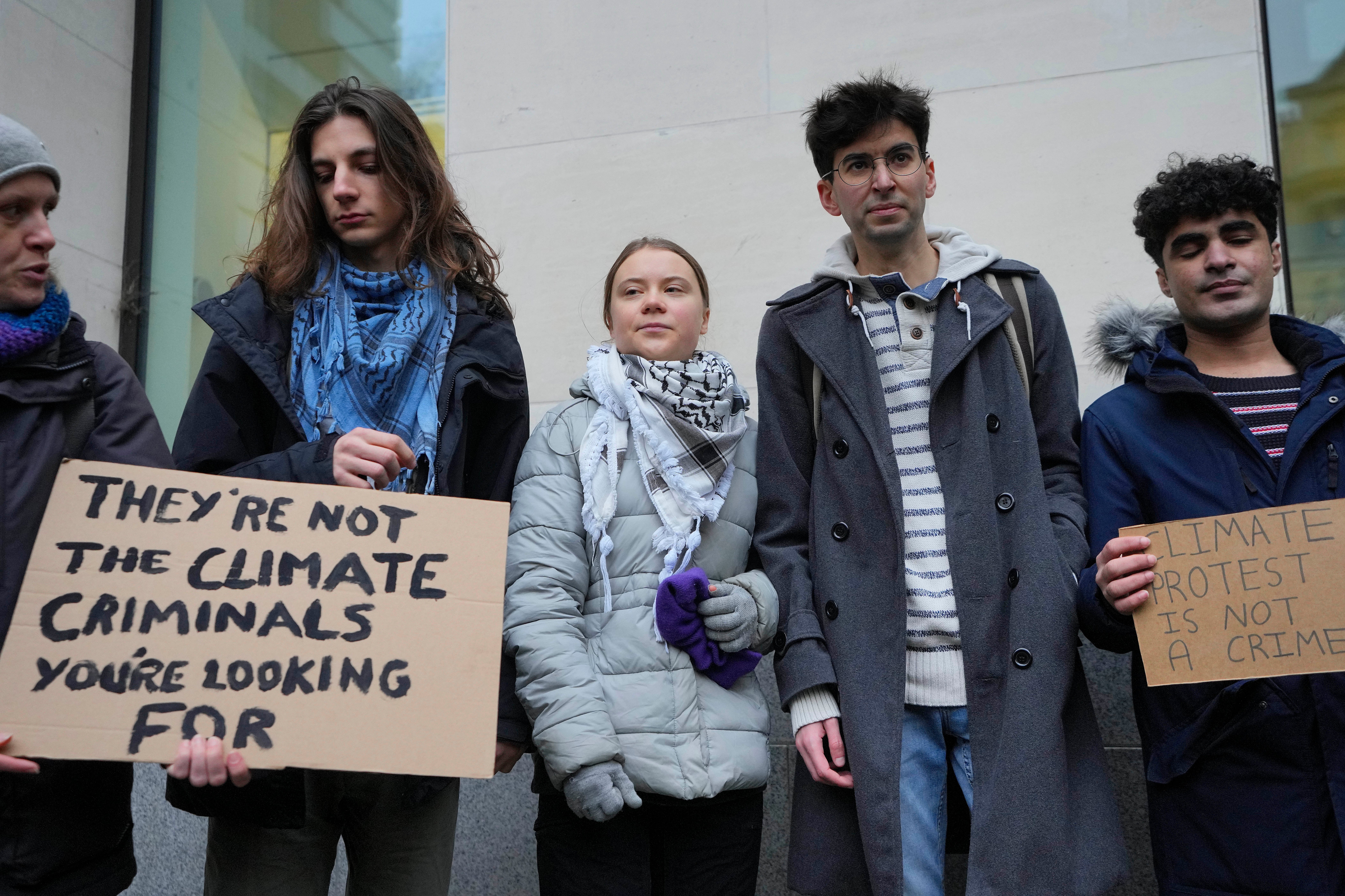 Greta Thunberg, centre, with other protesters at Westminster Magistrates Court on Friday