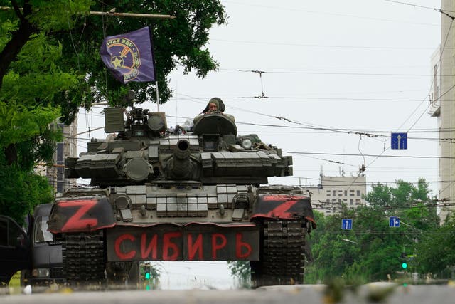 <p>Members of Wagner group sit atop of a tank in a street in the city of Rostov-on-Don, on June 24, 2023</p>