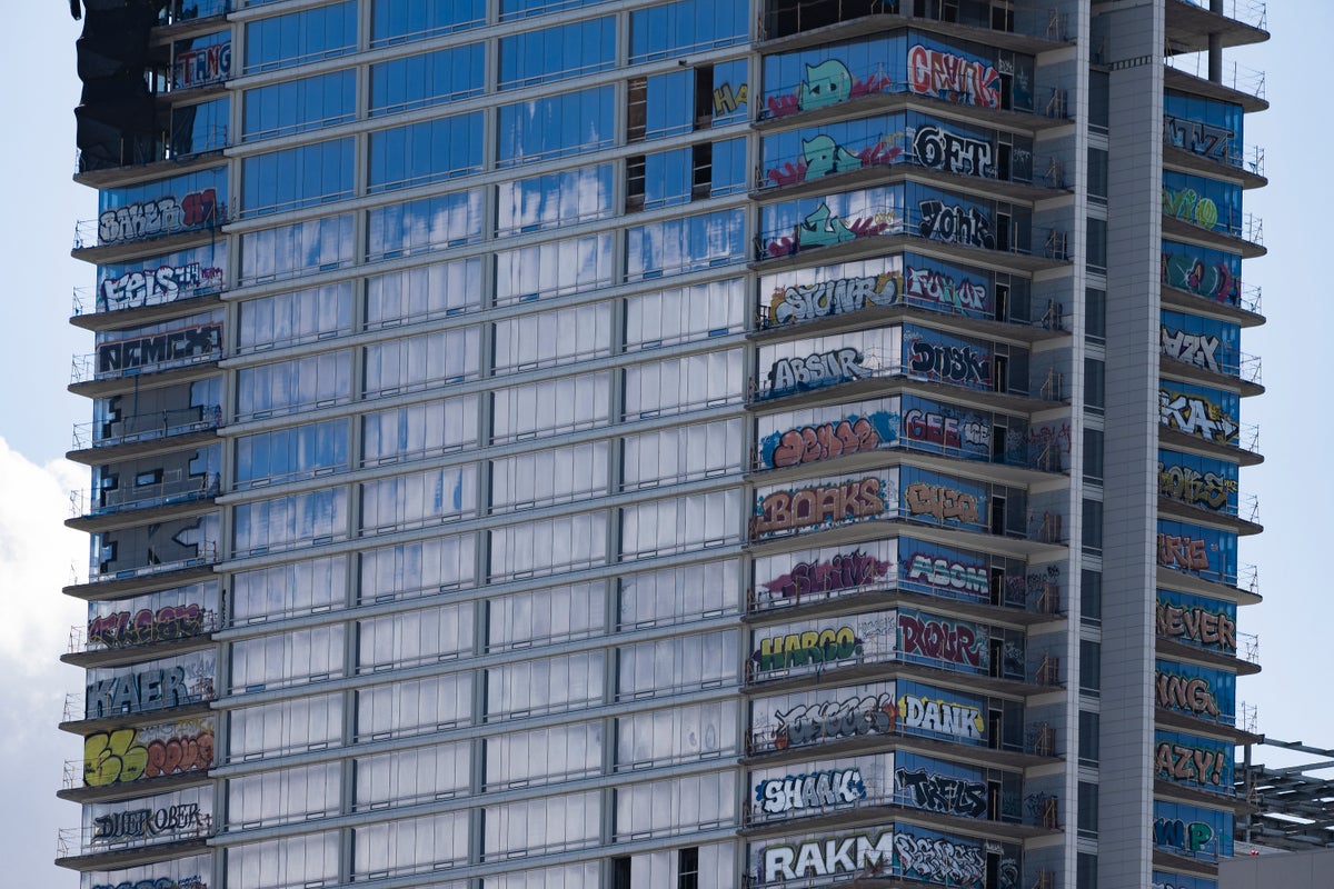 Crews take steps to secure graffiti-scarred Los Angeles towers left unfinished by developer