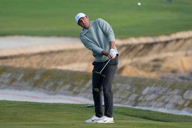 Scottie Scheffler chips to the 18th green at Pebble Beach Golf Links during the second round of the AT&T Pebble Beach National Pro-Am (Eric Risberg/AP)