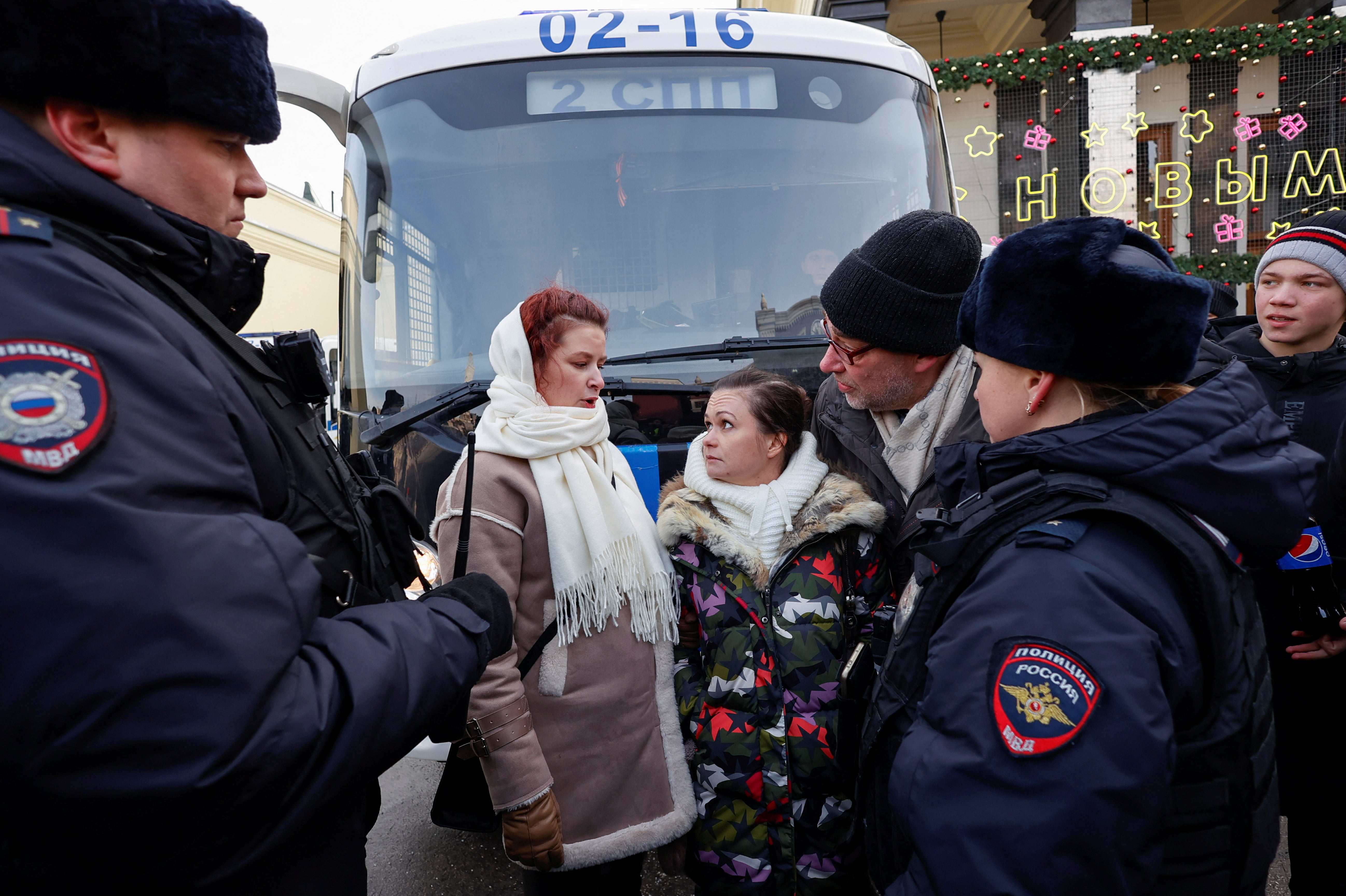 Protesters were pictured surrounded by police officers during the gathering in central Moscow