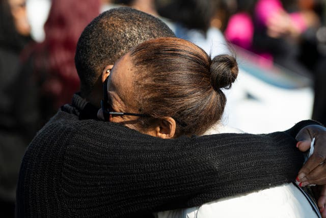 <p>Mourners hug outside Victory City Church in Joliet, Ill. after the funeral for Christine and William Esters, Tameaka, Joshua, Alexandria, Alonnah and Angel Nance.Romeo Nance killed all seven of his relatives and another victim</p>