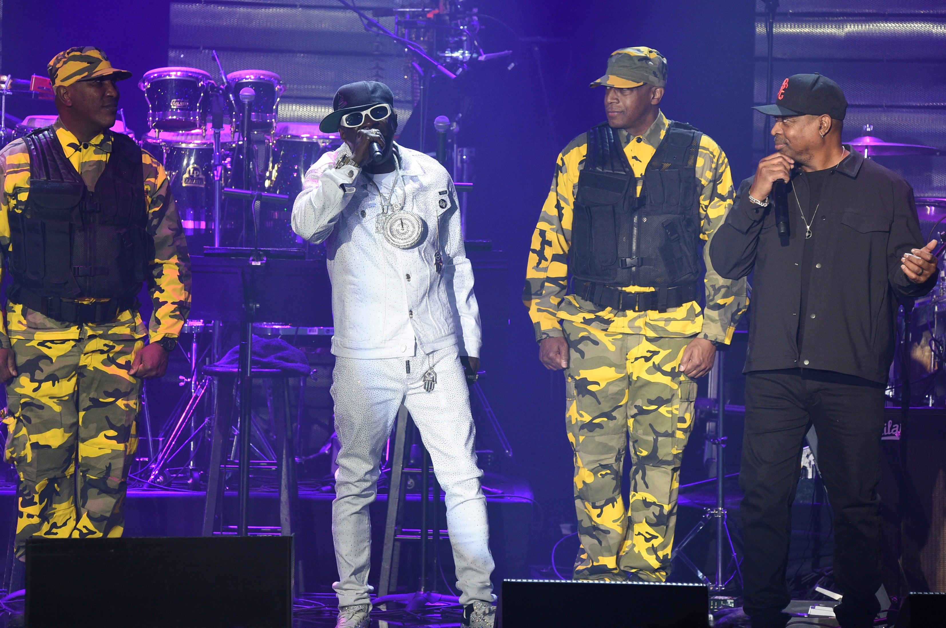 Flavor Flav, left, and Chuck D and of Public Enemy perform during the Pre-Grammy Gala in 2024