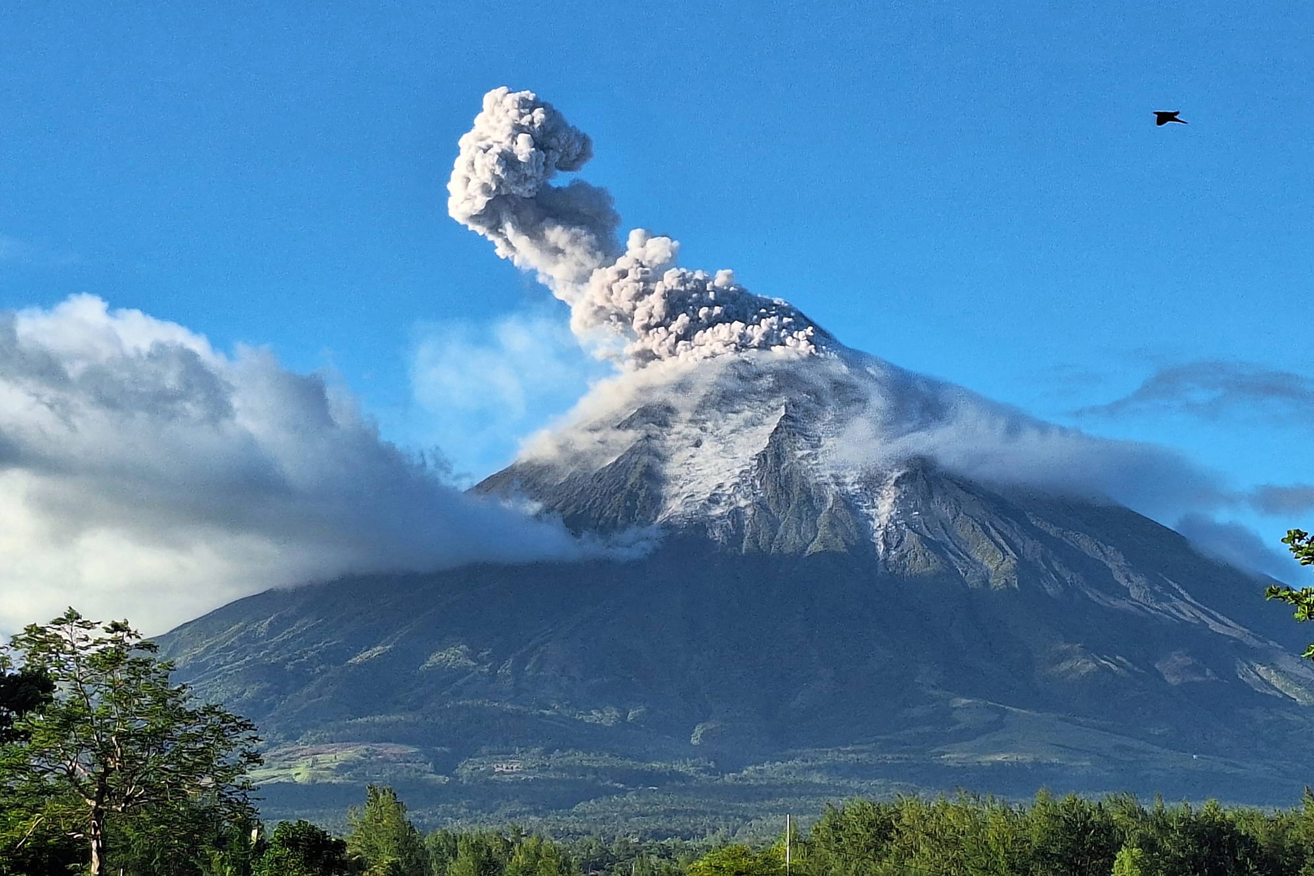 Mayon volcano releases ash into the air