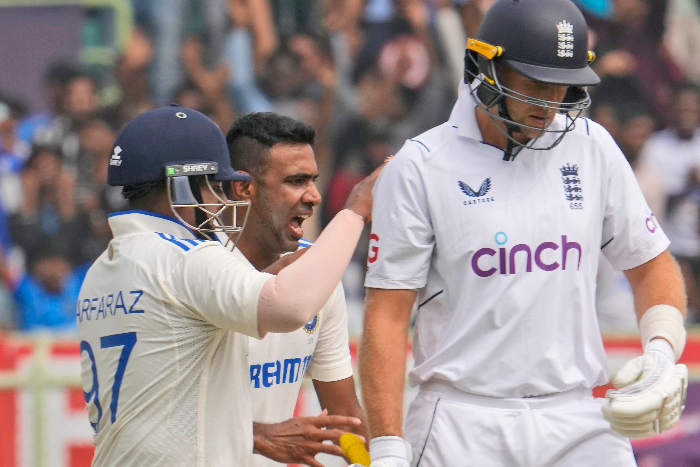 India’s Ravichandran Ashwin, centre, celebrates the wicket of England’s Joe Root on the fourth day of the second match between India and England in Visakhapatnam, India (Manish Swarup, AP)
