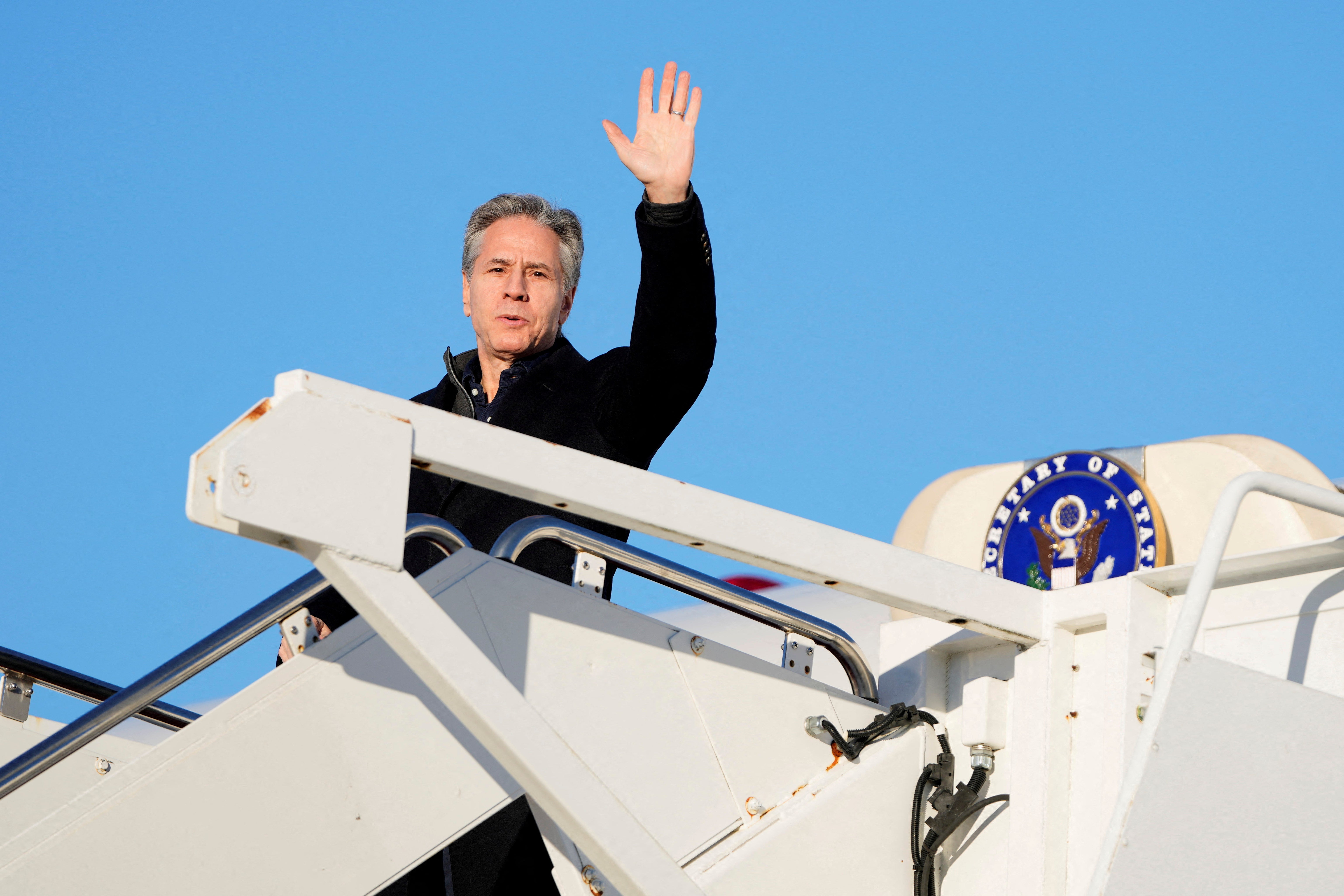 US secretary of state Antony Blinken waves as he boards a plane, en route to Saudi Arabia