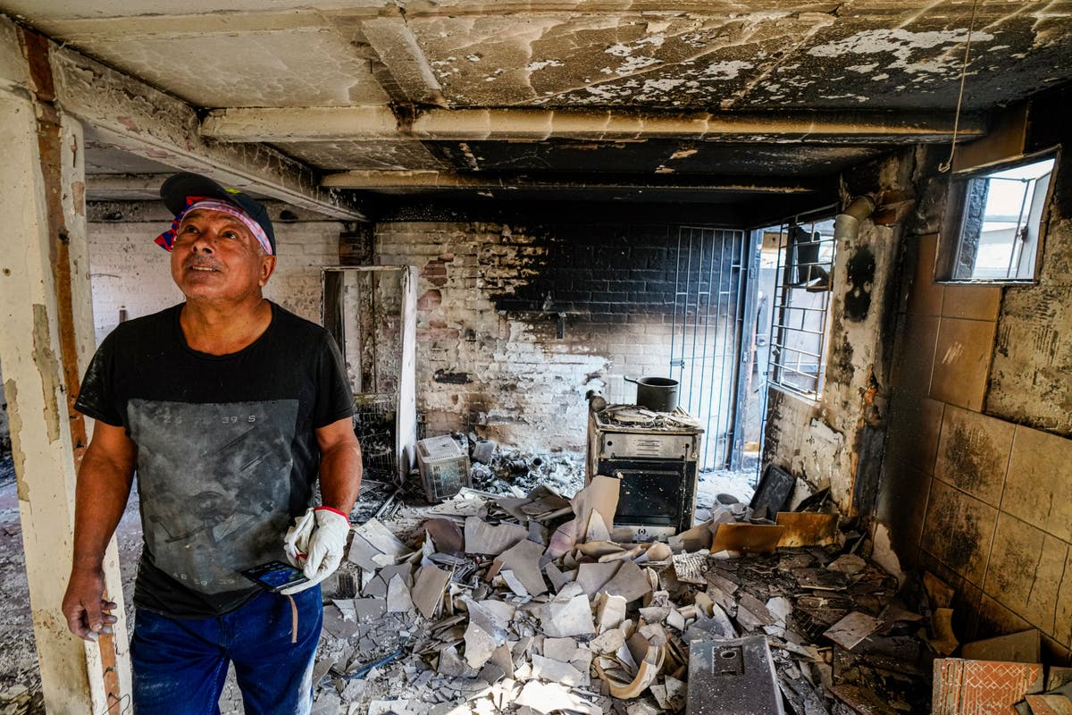 Survivors of Chile wildfires search through debris as death toll reaches 122