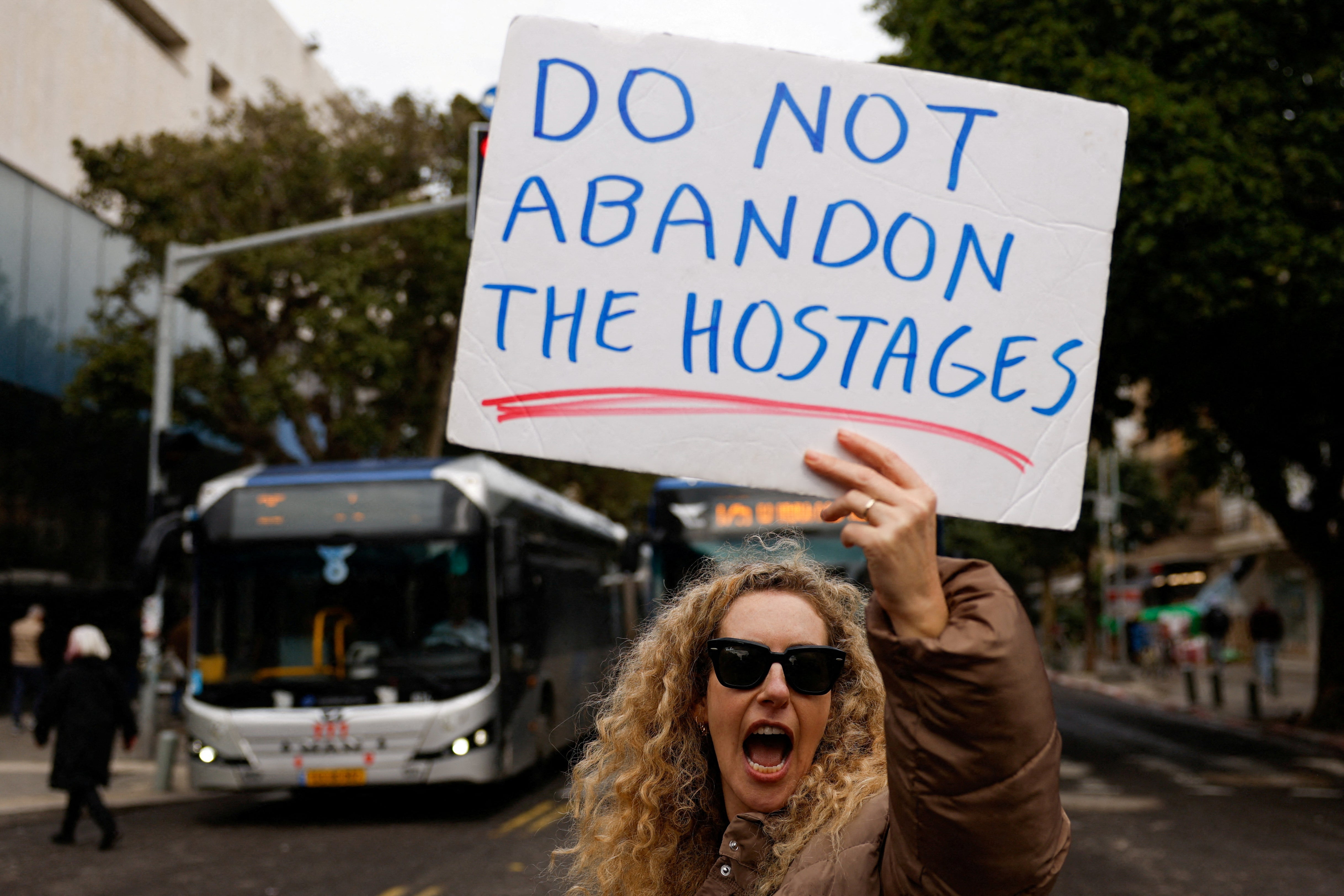 A woman takes part in a protest demanding a hostage deal in Tel Aviv earlier this month