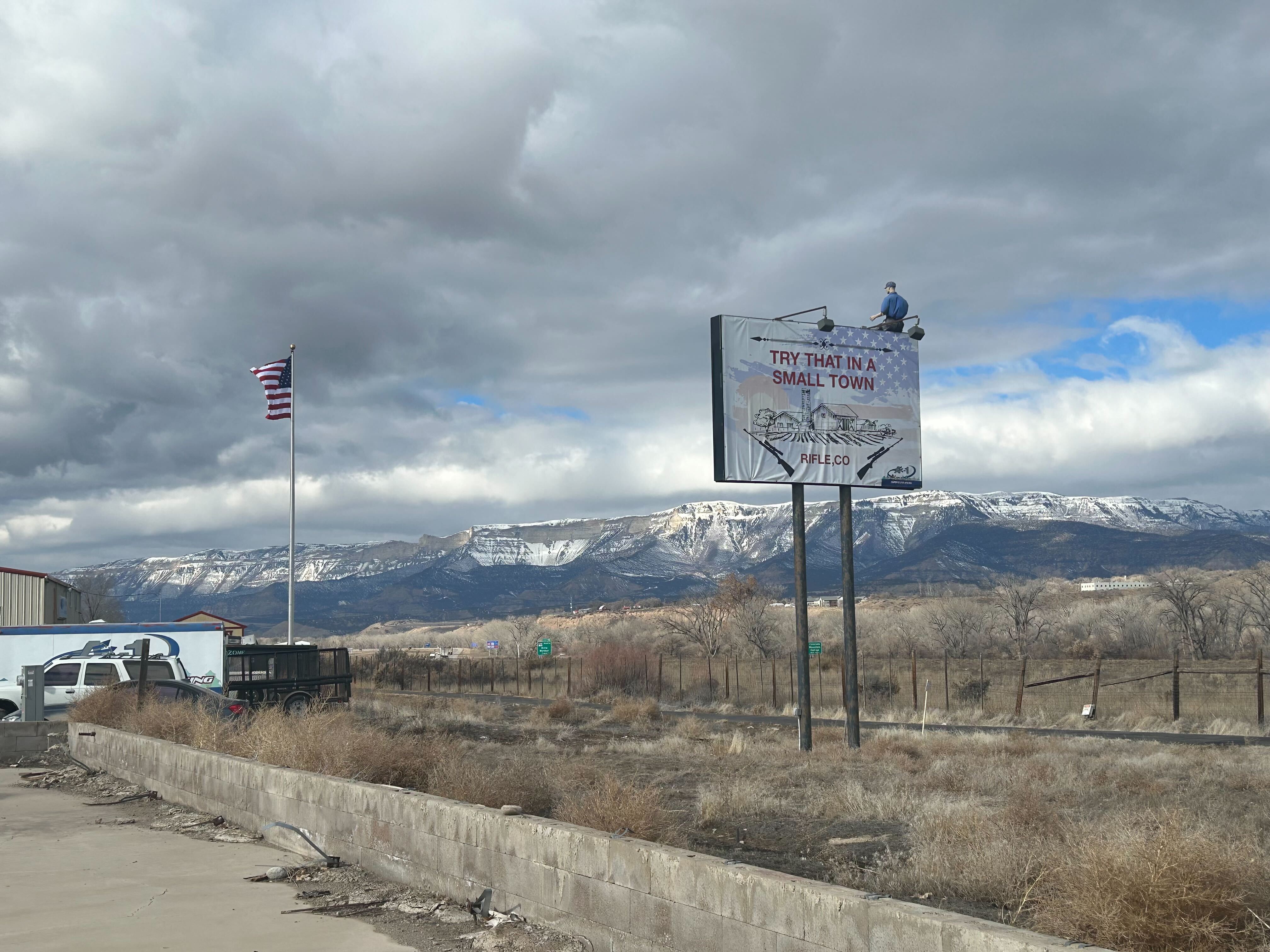 Boebert’s CD3 voter base is conservative and initially embraced her gun-toting, brash image; a sign in Rifle showcases those local values