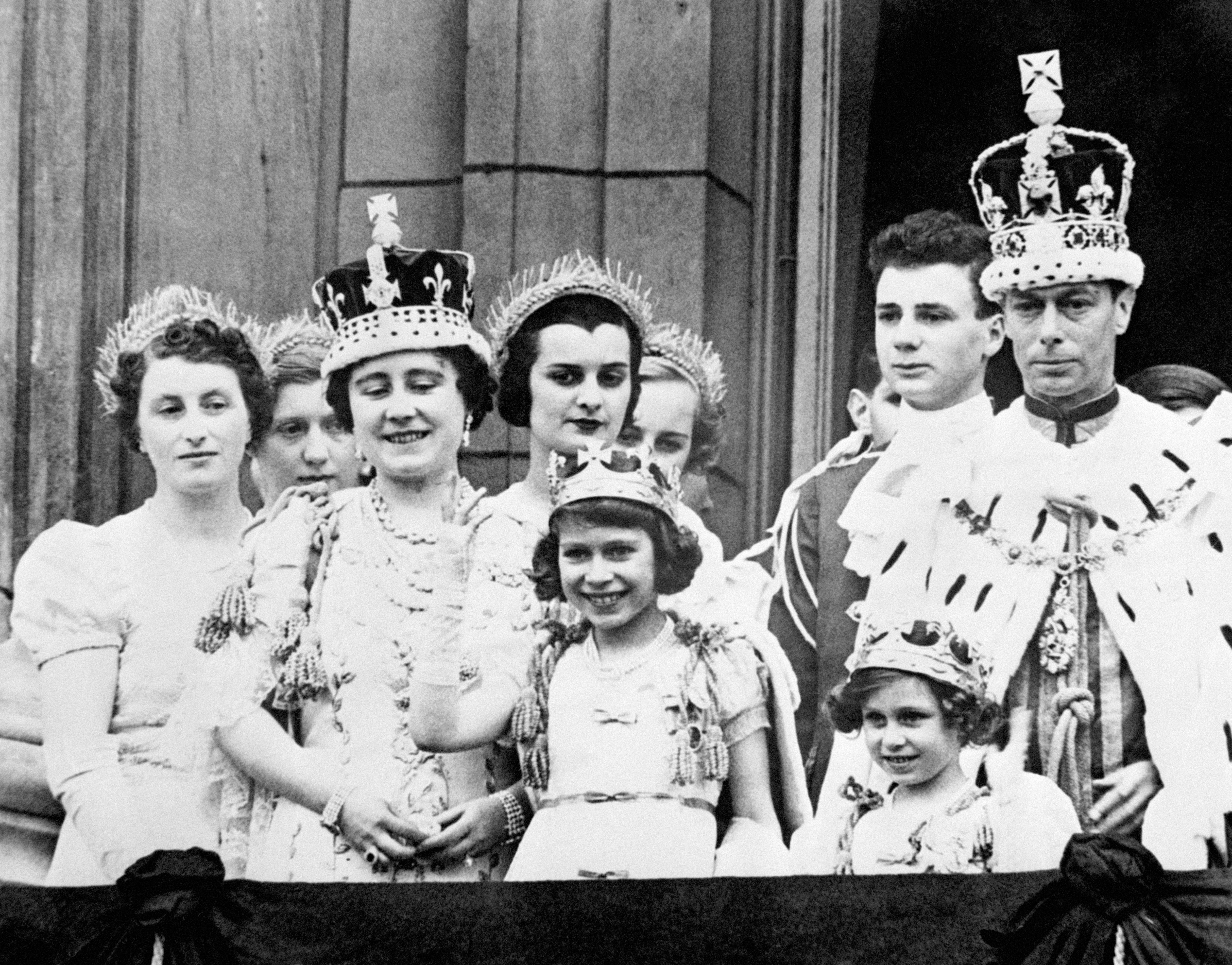Queen Elizabeth (later the Queen Mother), Princess Elizabeth (the present Queen Elizabeth II), Princess Margaret and King George VI after his coronation, on the balcony of Buckingham Palace, London