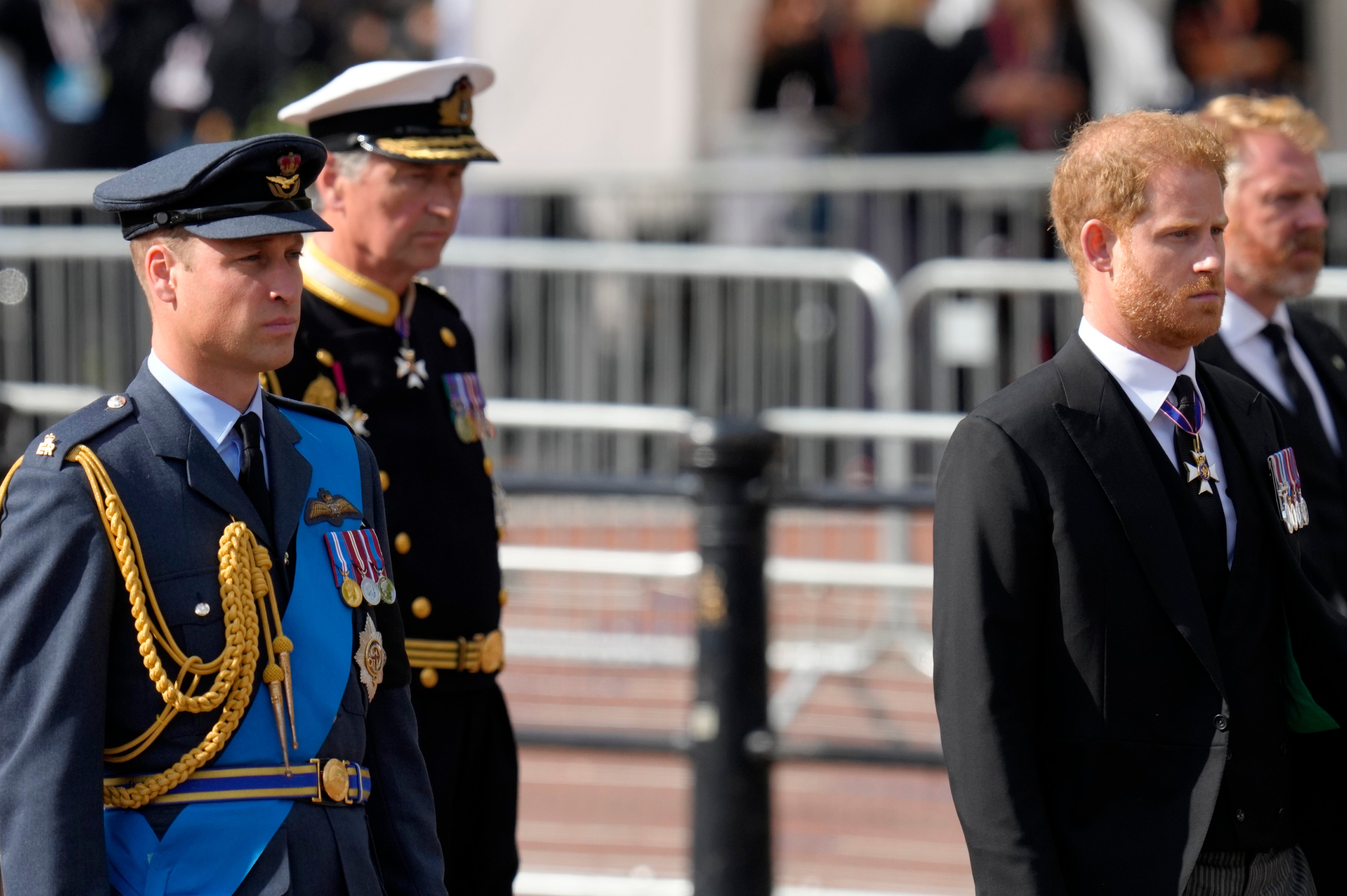 Britain’s King Charles III, second left, Prince Harry, second right, and Prince William, left, follow the coffin of Queen Elizabeth II during a procession from Buckingham Palace to Westminster Hall