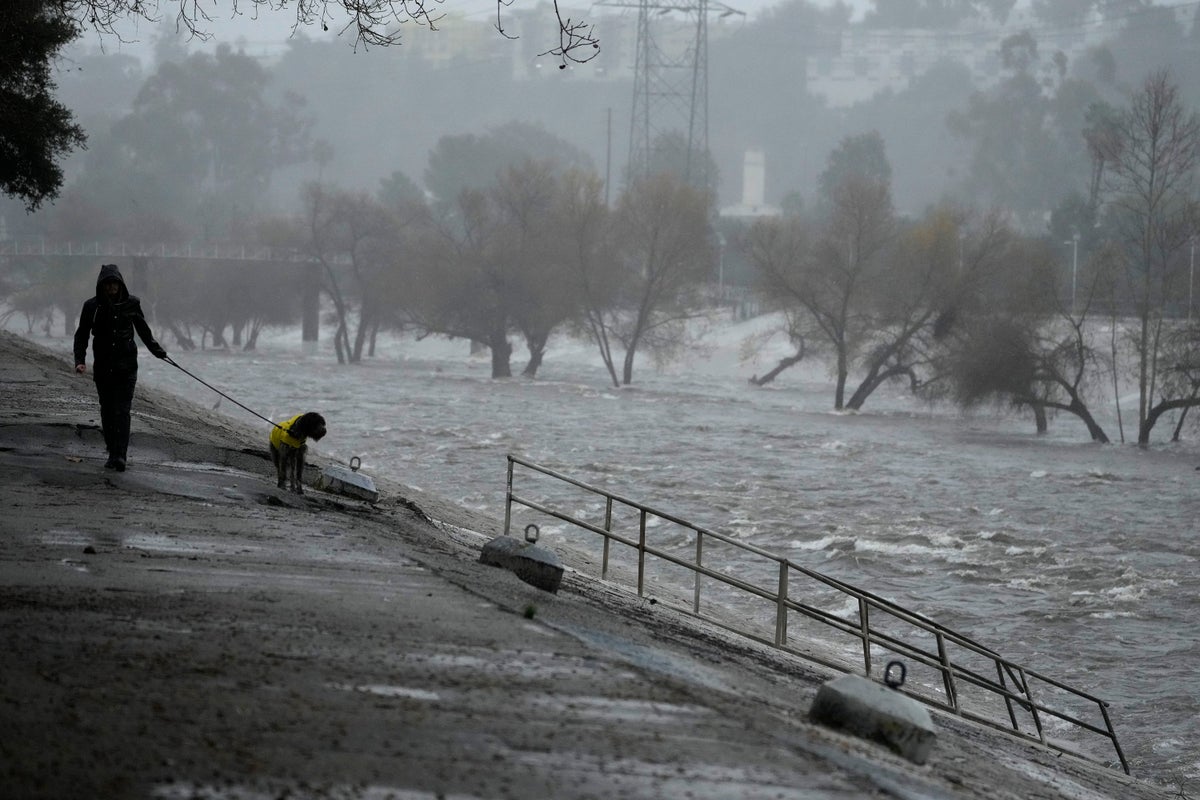Normally at a crawl, the Los Angeles River threatens to overflow during torrential rains