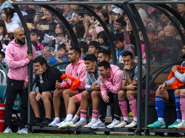 <p>Inter Miami’s Lionel Messi, sixth from left, looks on from the bench during the friendly football match between Hong Kong Team and US Inter Miami CF at the Hong Kong Stadium in Hong Kong</p>