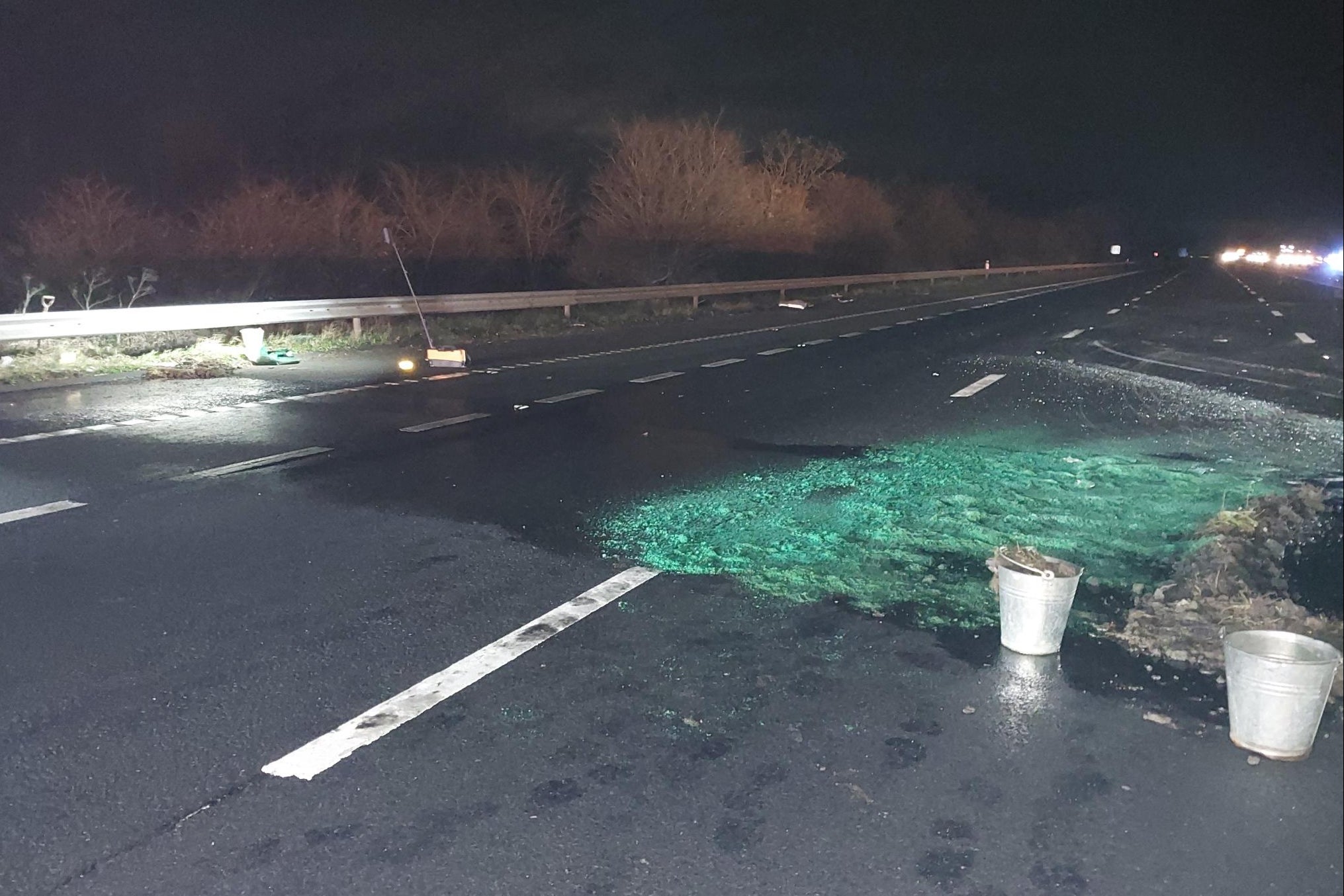 The HGV’s fuel tank has ruptured and has spilled out onto the carriageway