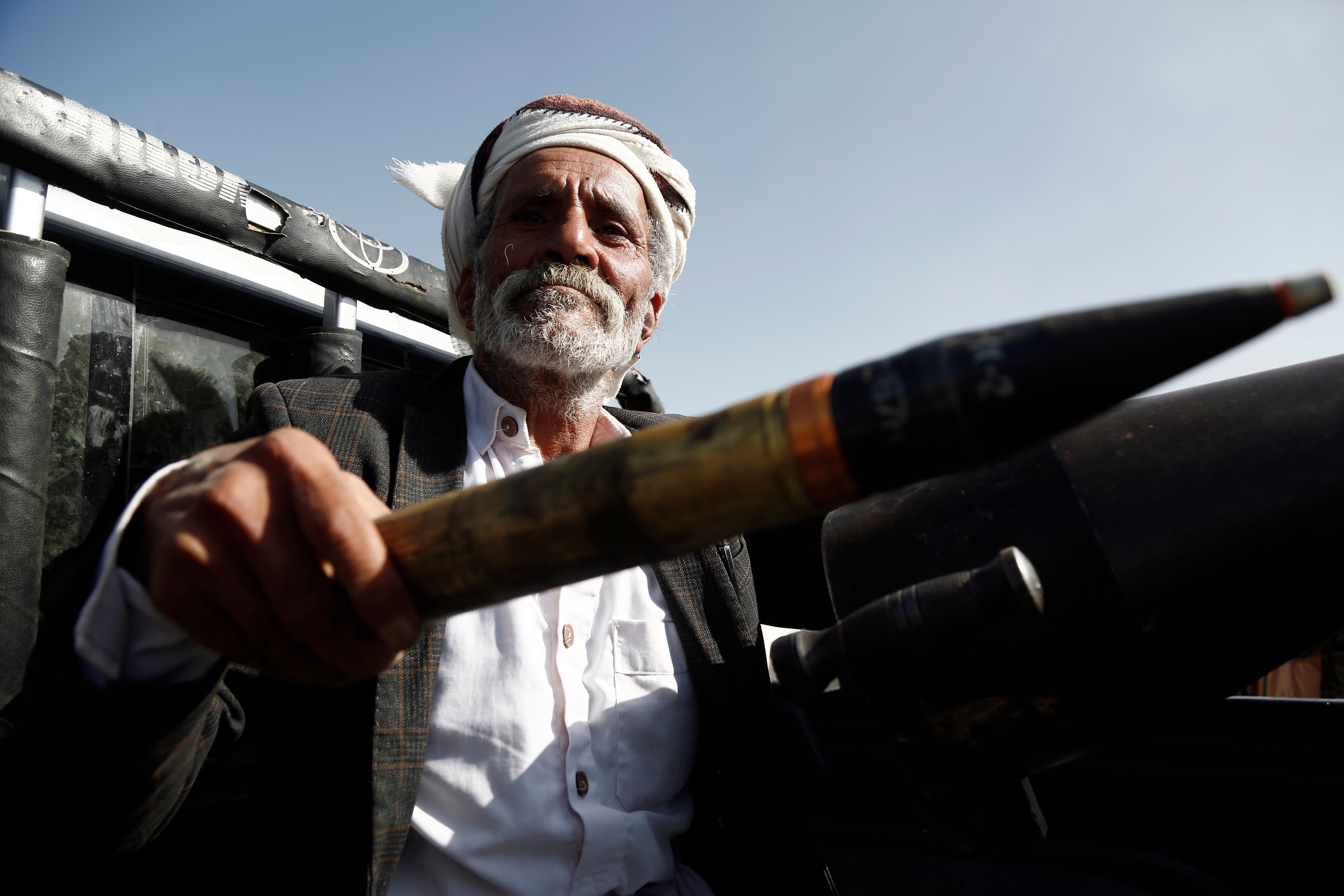 An elderly Houthi fighter mans a cannon mounted on a vehicle at a rally in support of Palestinians in the Gaza Strip