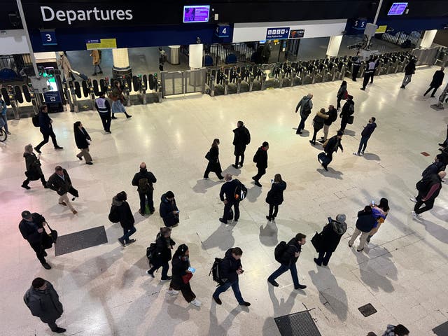 <p>Which way now? Commuters at London Waterloo station, hub for South Western Railway </p>