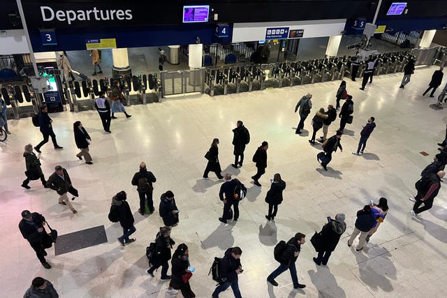 <p>Which way now? Commuters at London Waterloo station, hub for South Western Railway </p>
