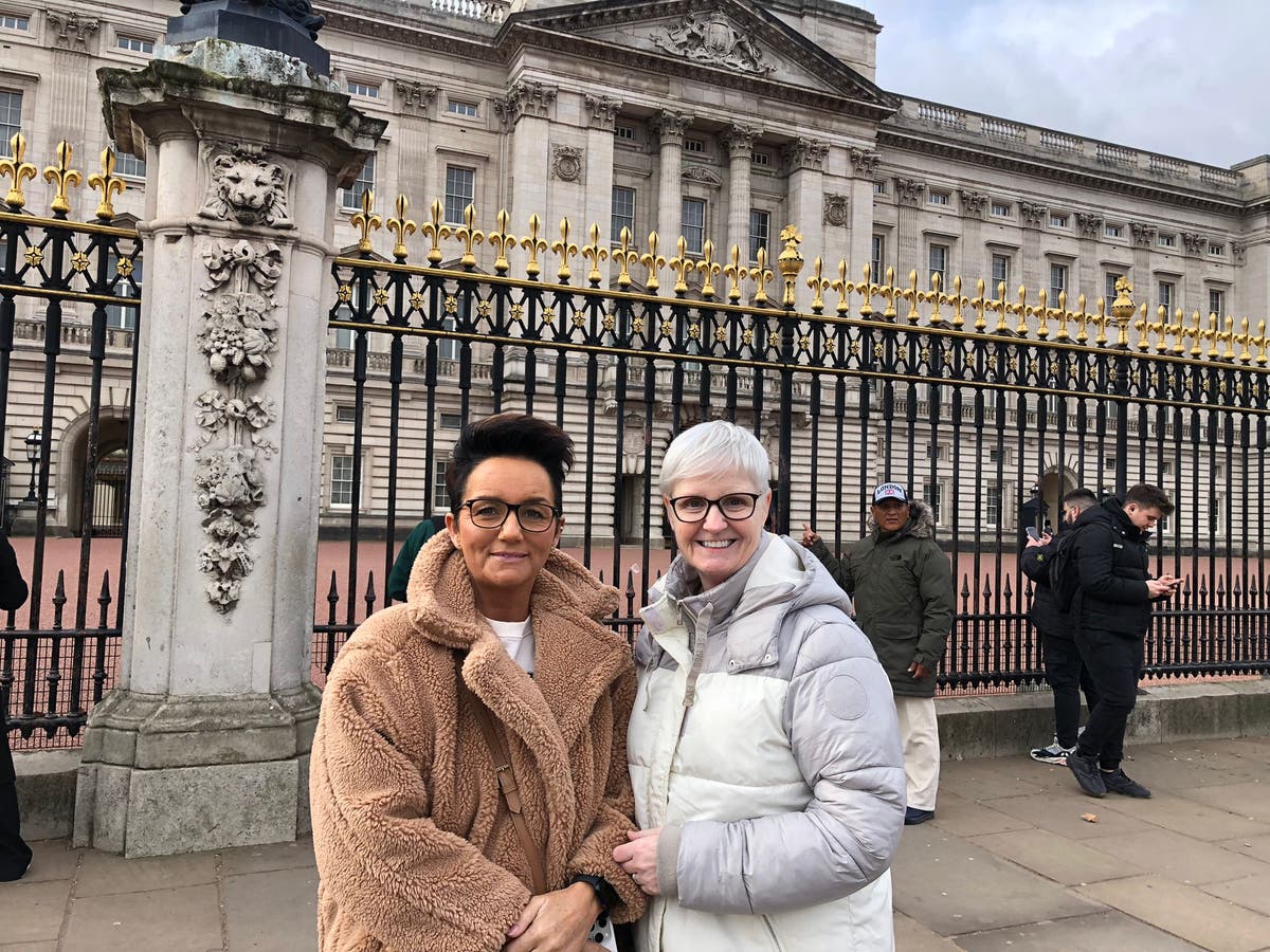 ‘It makes him more human’: Wellwishers at Buckingham Palace send messages of support to King Charles