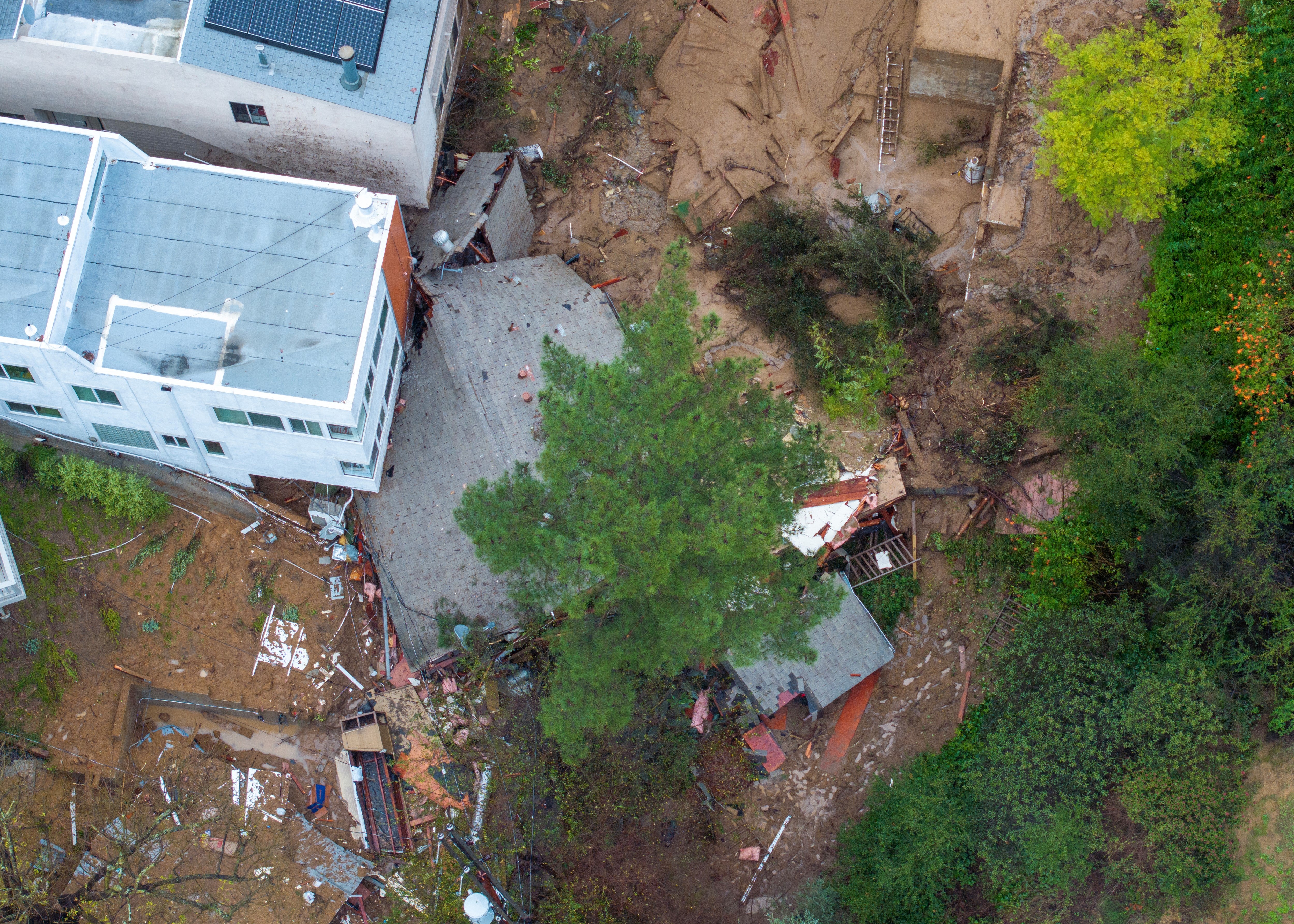 An aerial image of a home destroyed by a landslide in Los Angeles, California on Monday