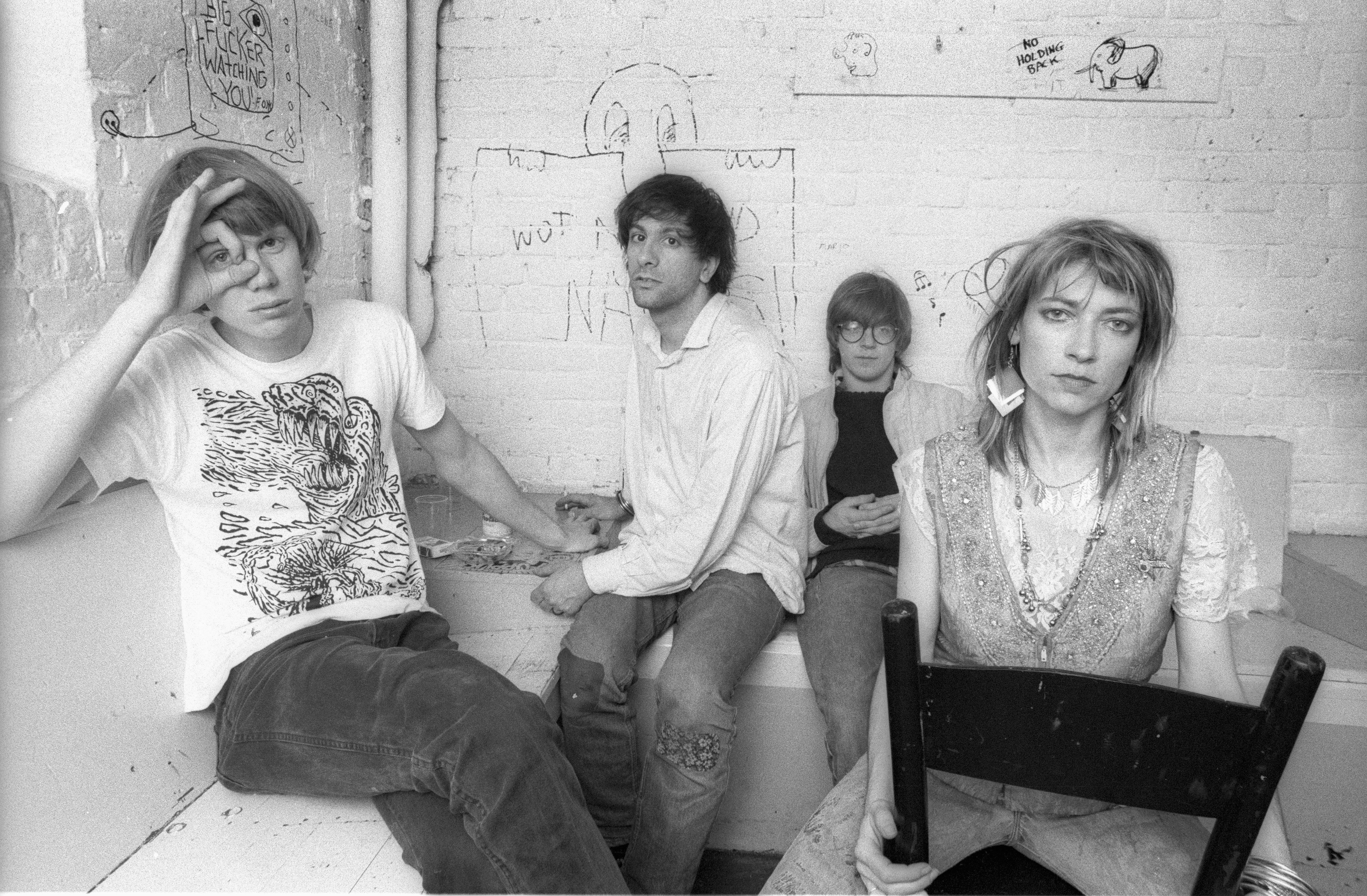 A group portrait of Sonic Youth, (L-R) Thurston Moore, Lee Ranaldo, Steve Shelley and Kim Gordon, posing backstage at Paradiso in Amsterdam on 11 May 1986