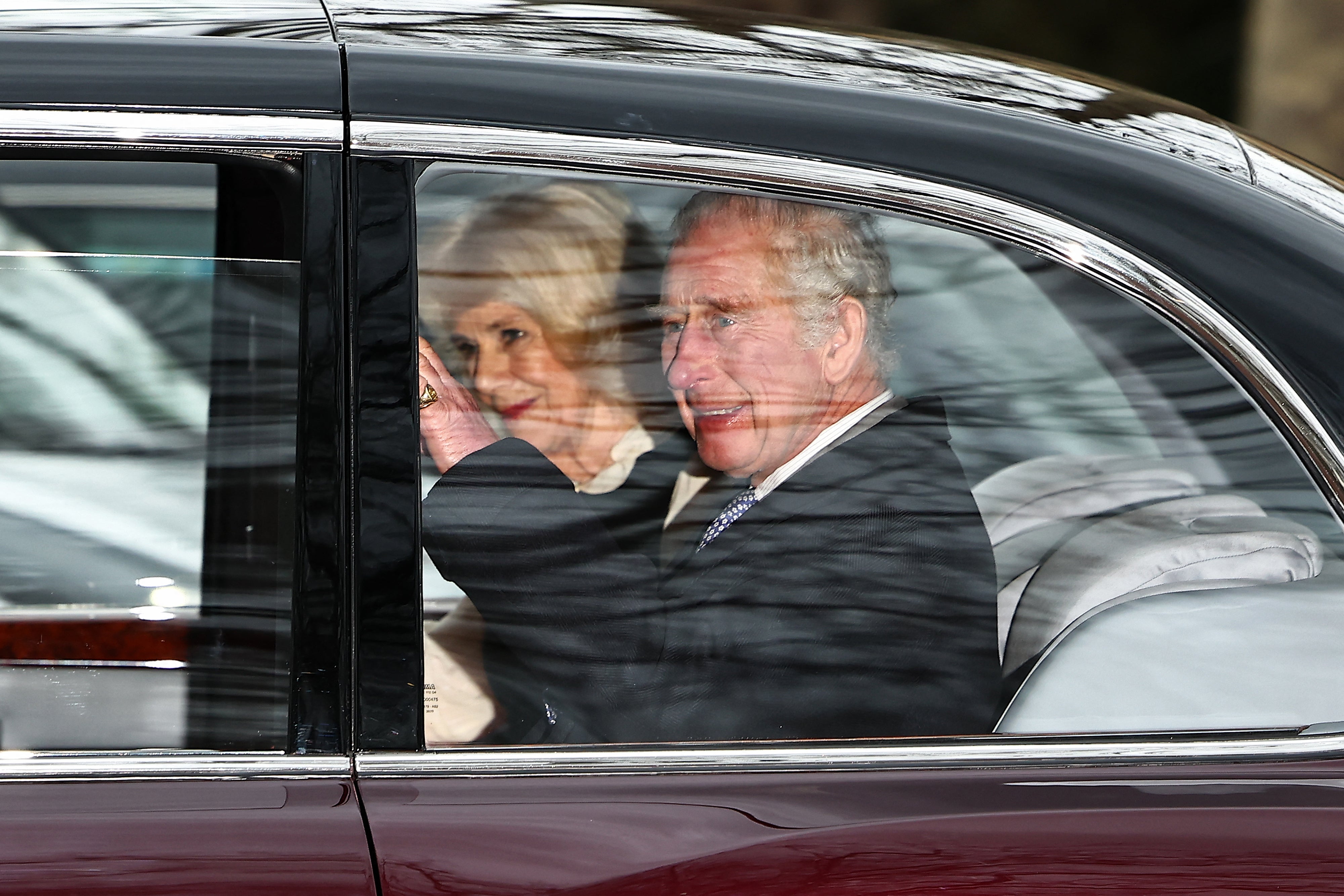 Charles and Camilla wave as they leave Clarence House in London