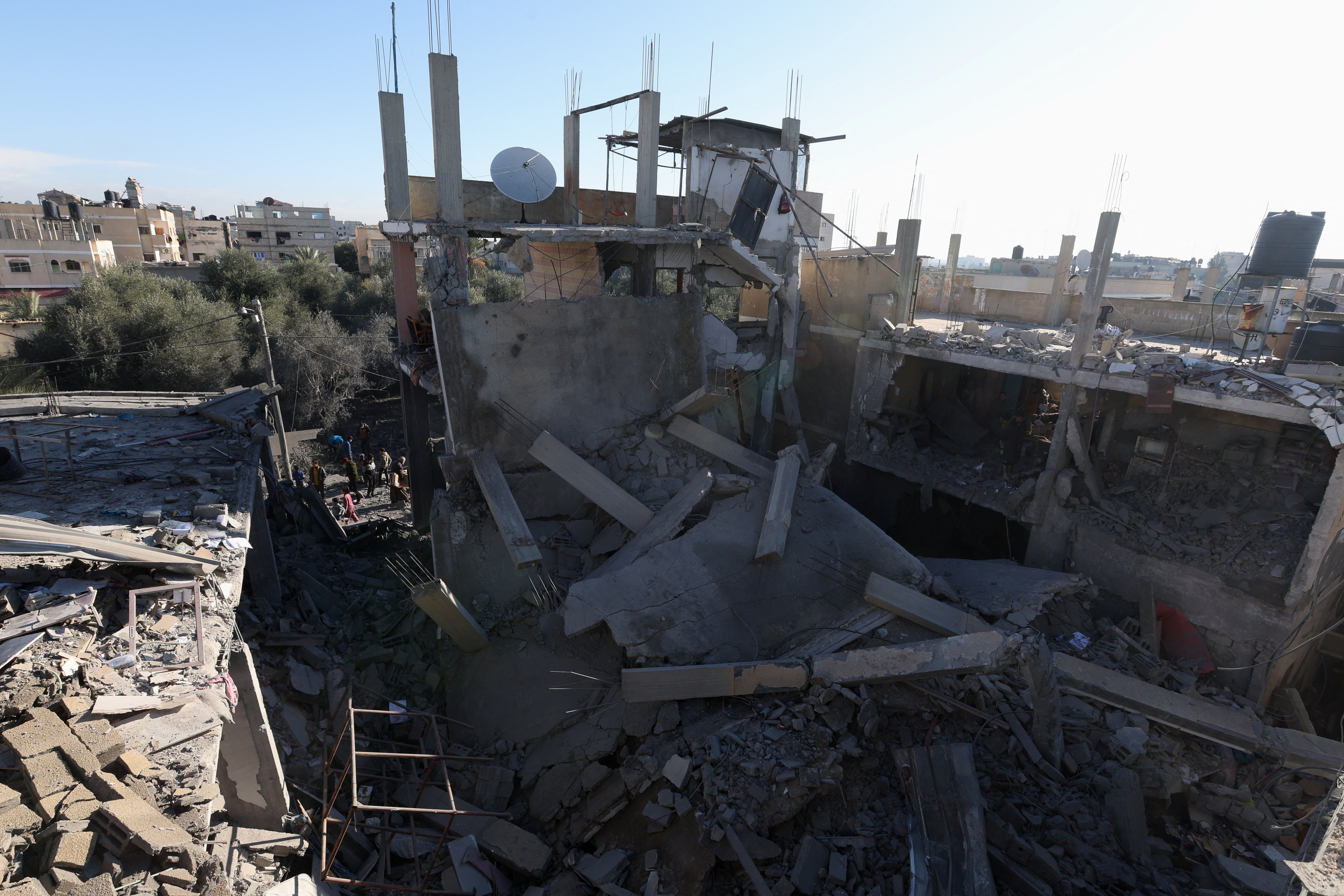 Palestinians gather at the site of an Israeli strike in Rafah, southern Gaza