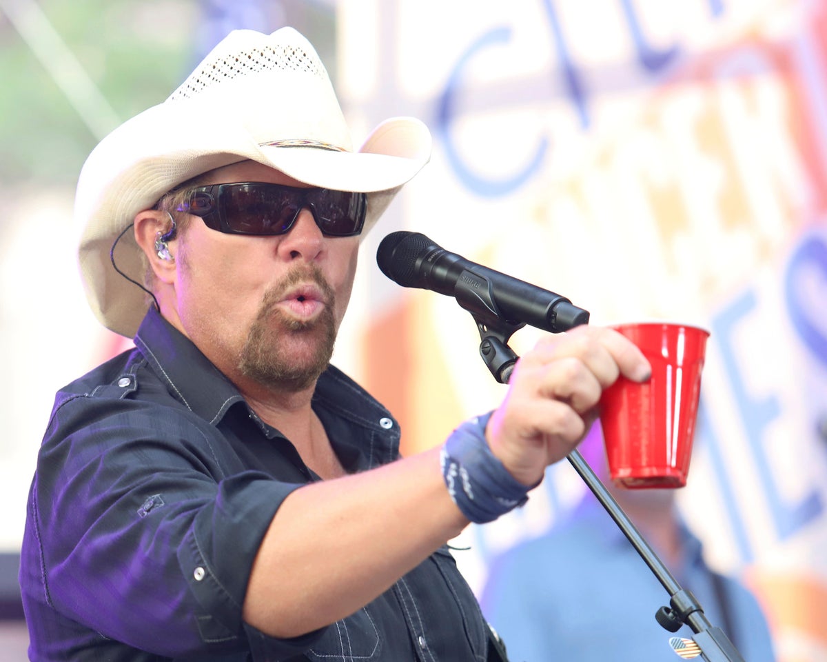 Fans raise a red Solo cup to honor Toby Keith, who immortalized the humble cup in song