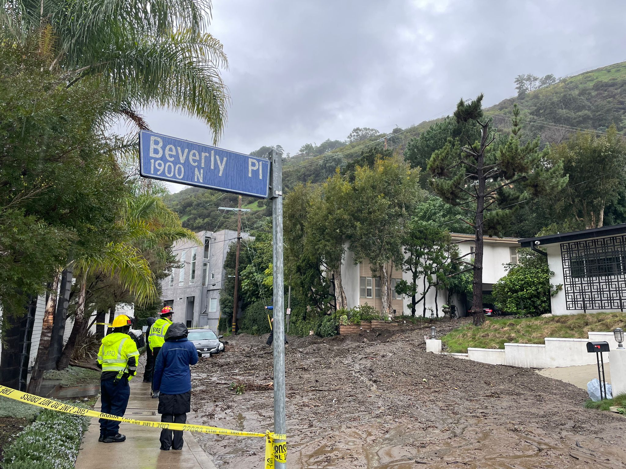 Firefighters at the scene of the slide on Tuesday