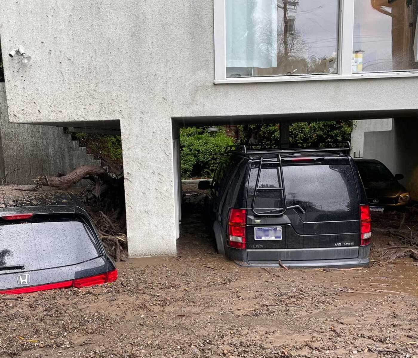 Cars submerged in mud up to the windshields