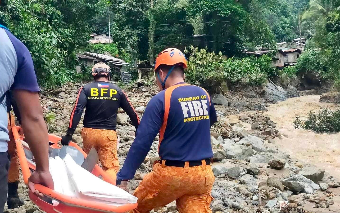 <p>Rescuers work  after dozens buried by mud and debris after a landslide hit a mining village in Davao de Oro province, southern Philippines </p>