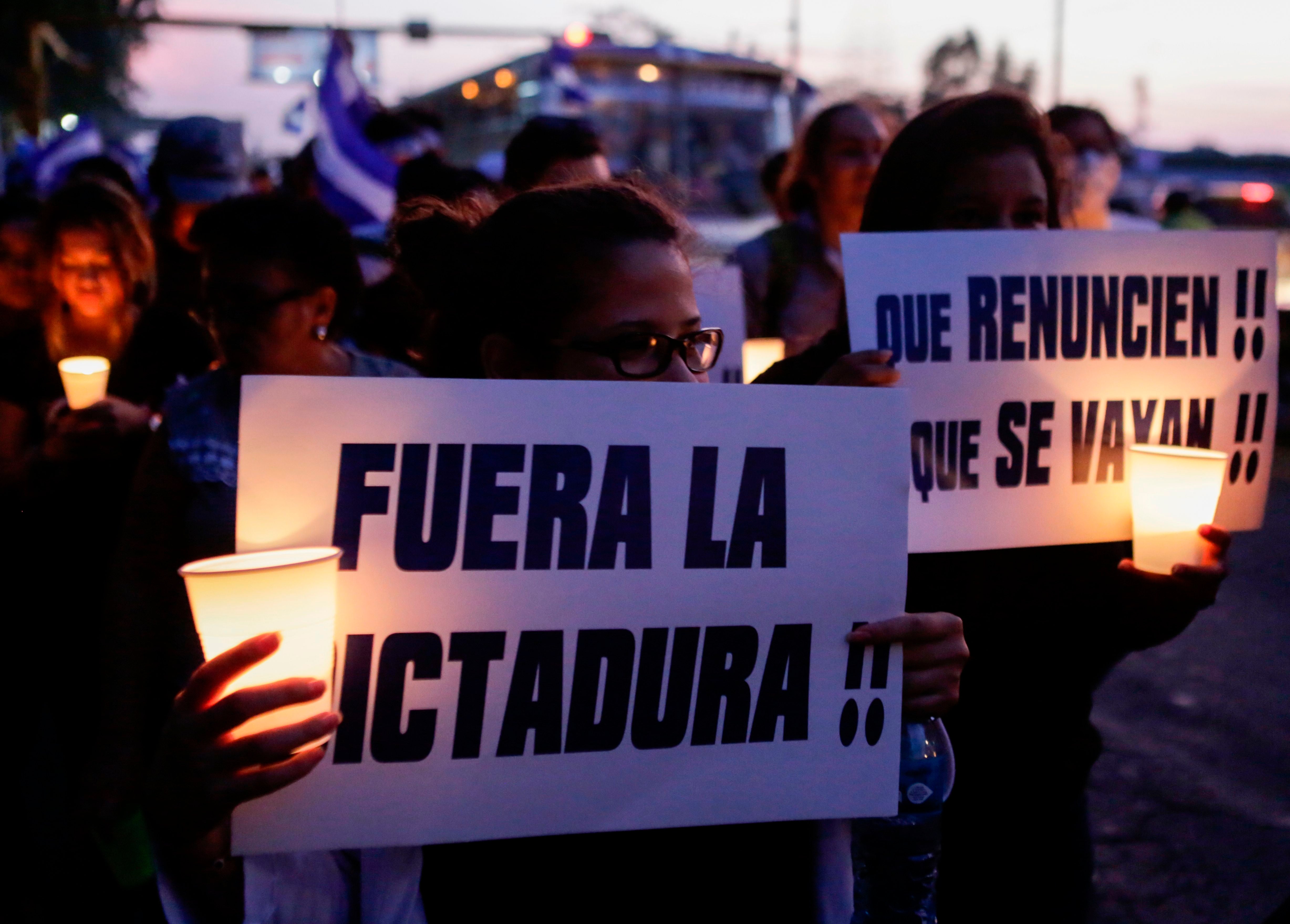 Students attend a protest demanding Ortega and his wife Rosario Murillo step down