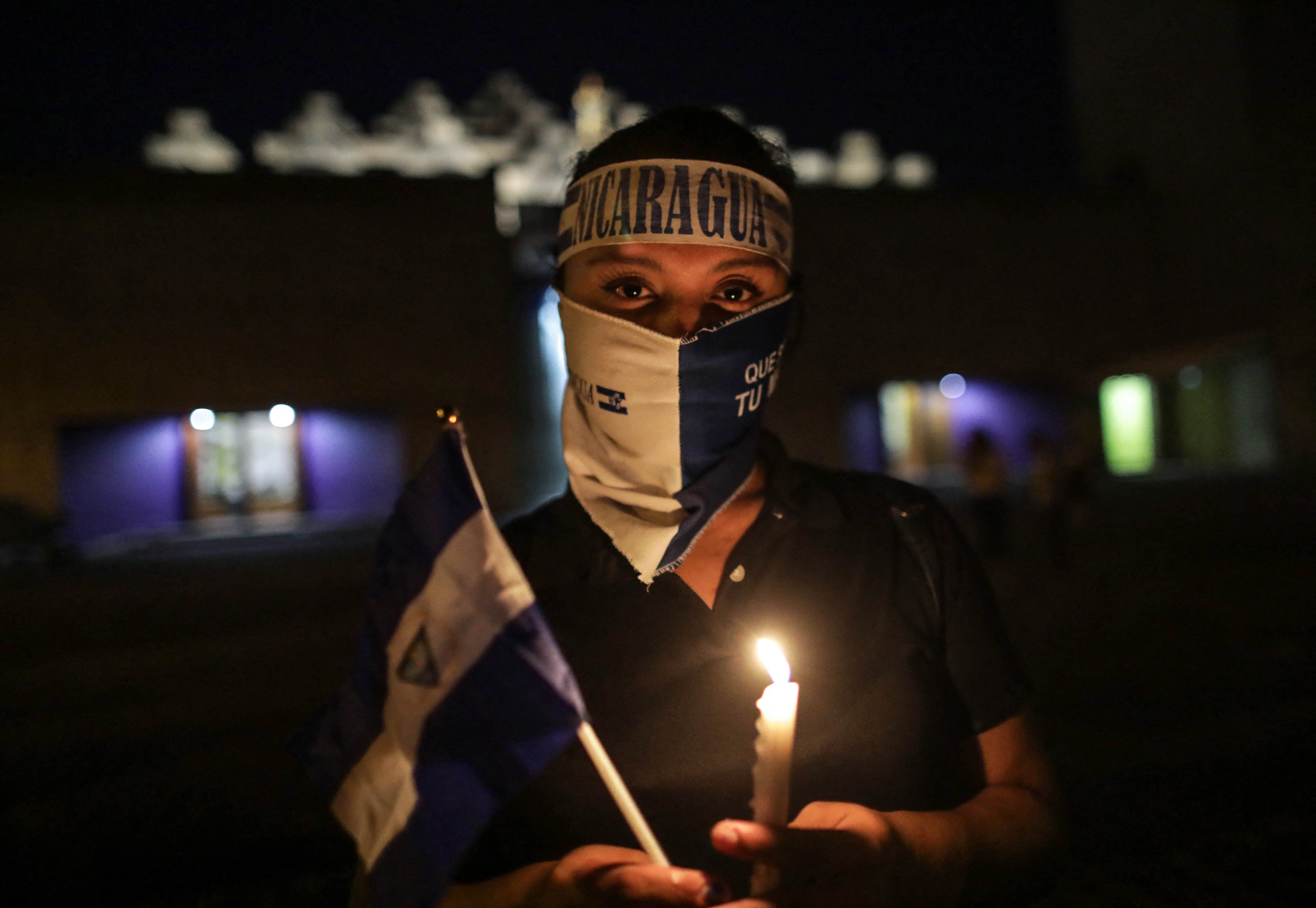 A demonstrator takes part in a vigil to demand the release of political prisoners