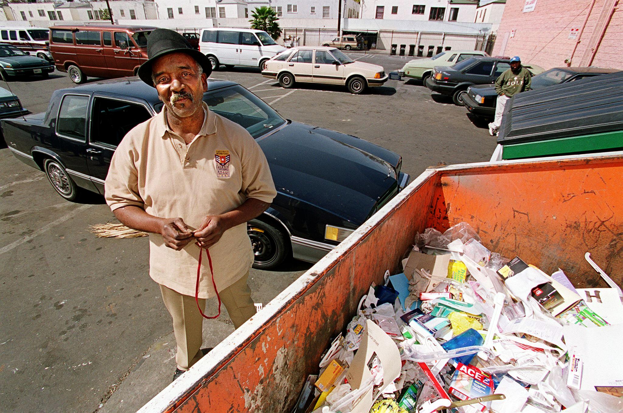 Willie Fulgear poses by the bins where he found the Oscars