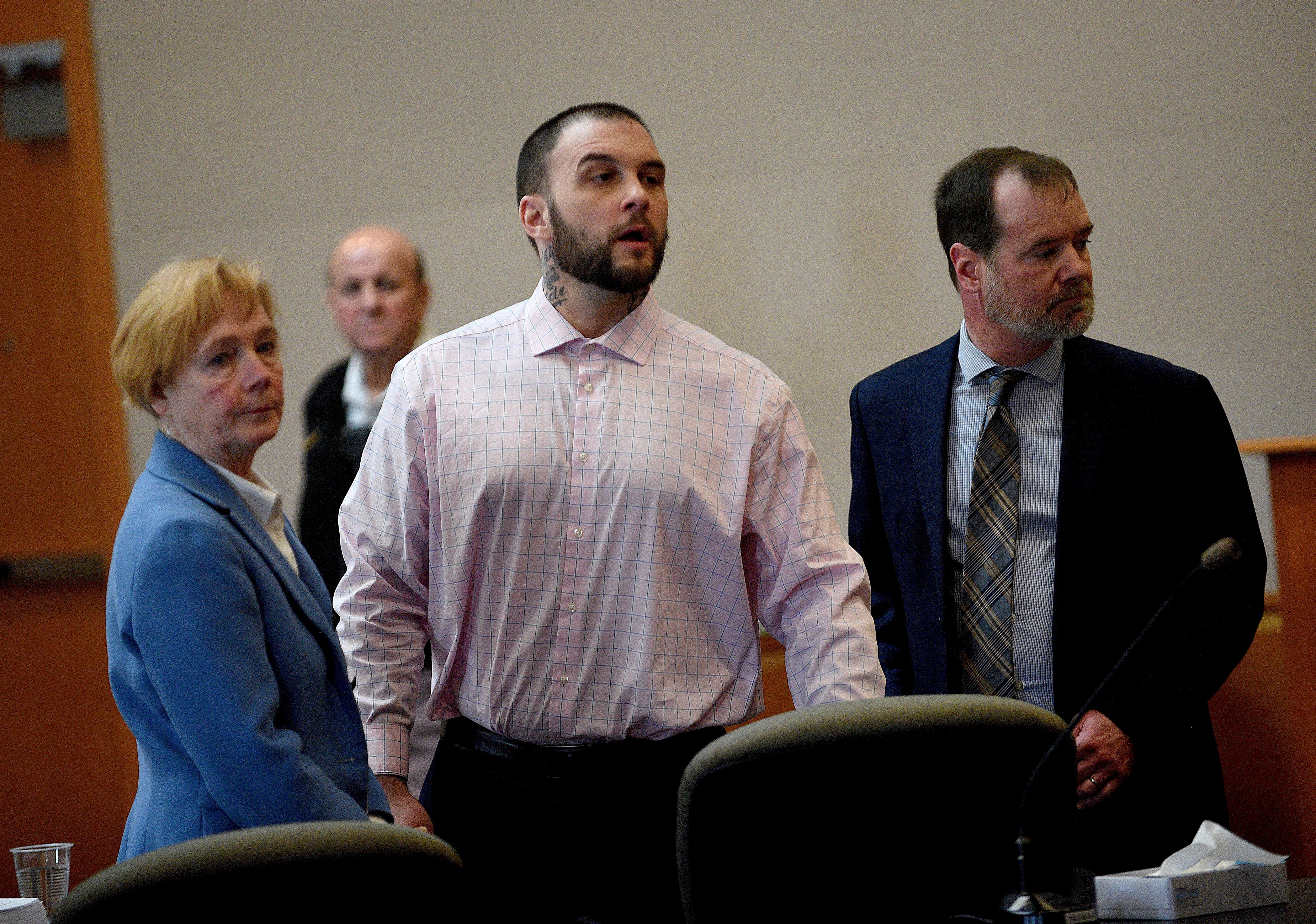 Adam Montgomery and his lawyers Caroline Smith and James Brooks watch as potential jurors enter the courtroom for jury selection ahead of his murder trial at Hillsborough County Superior Court in Manchester, New Hampshire, on Tuesday