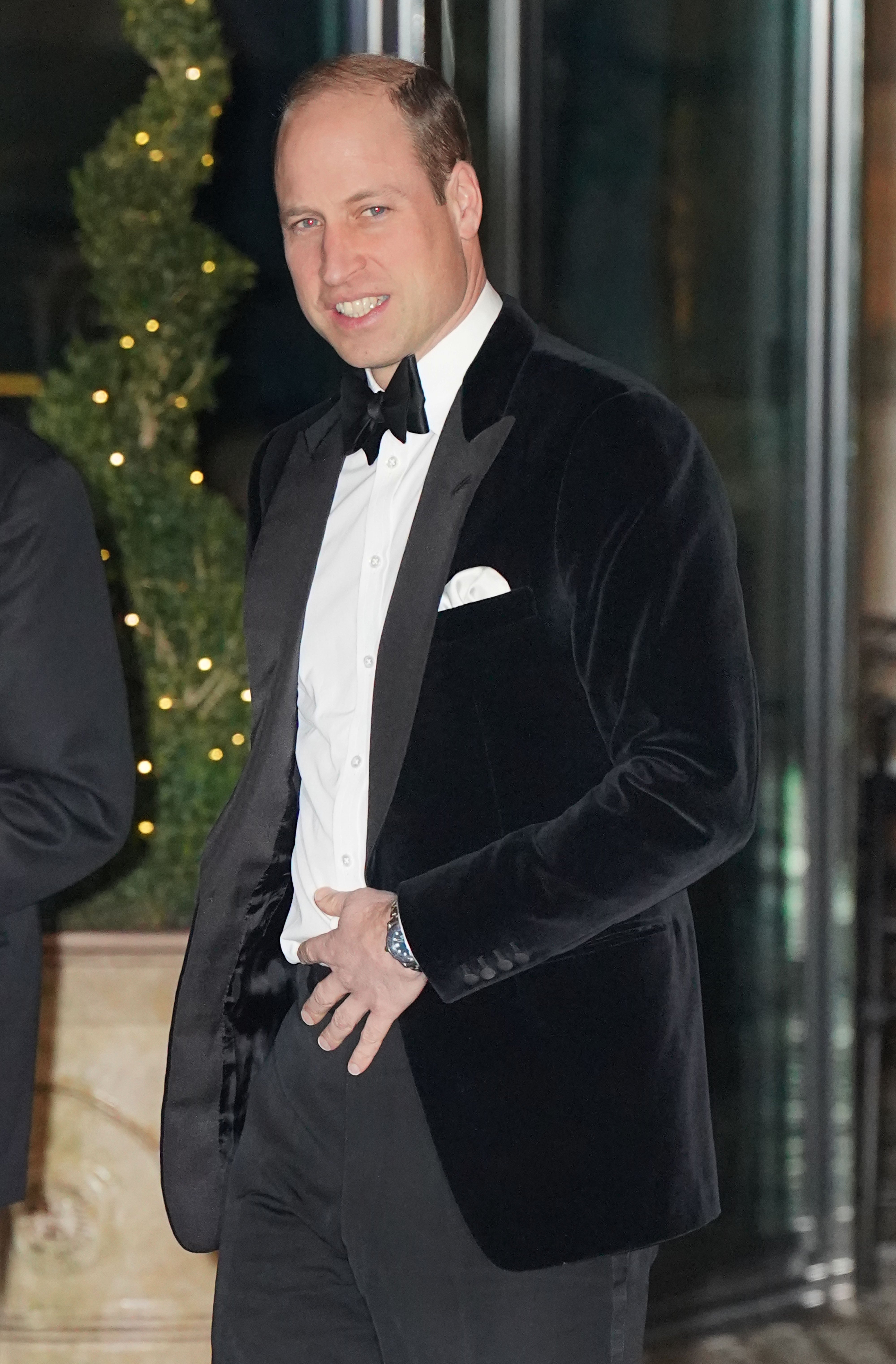 Prince William stops for photographers at the entrance to the gala dinner
