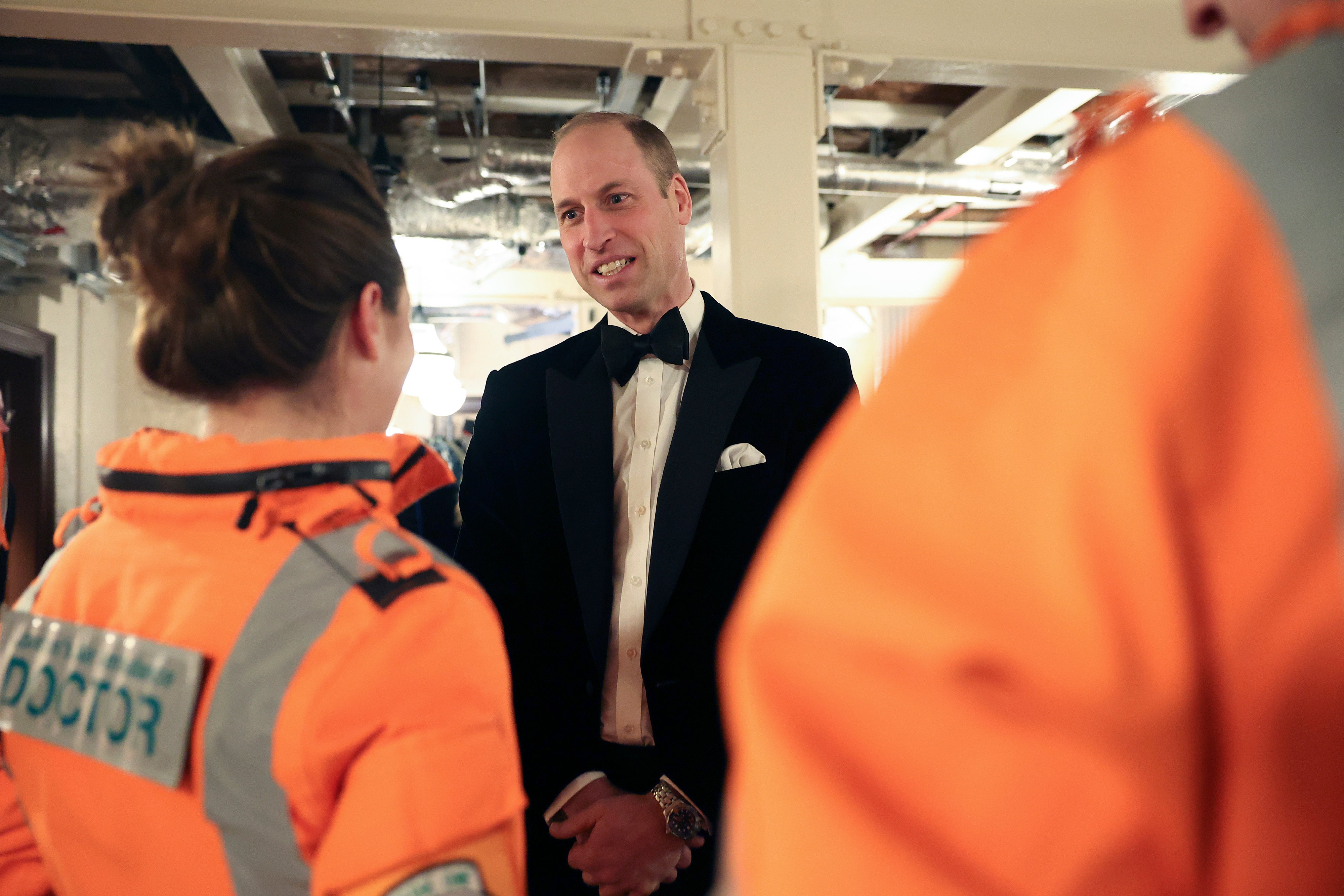Prince William speaks with London Air Ambulance pilots during the event on Wednesday evening