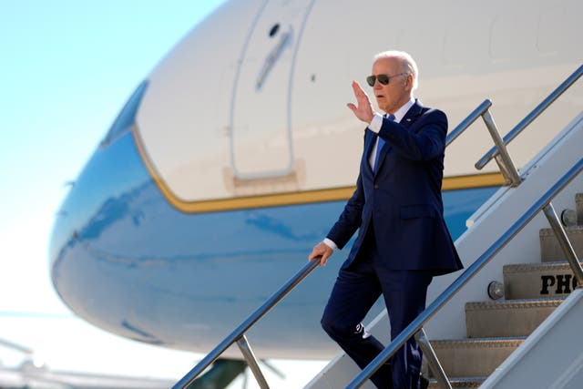 <p>President Joe Biden walks down the steps of Air Force One </p>
